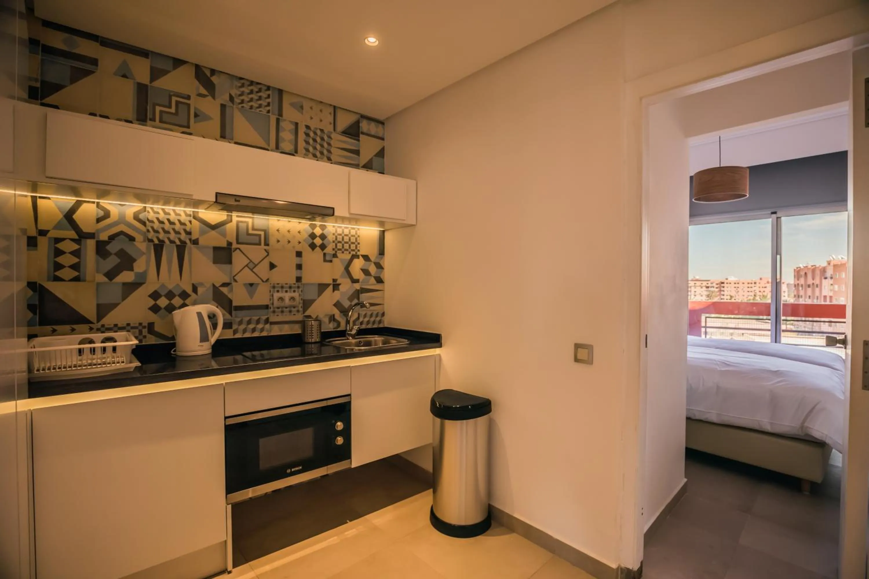 Kitchen or kitchenette, Bed in M Appart