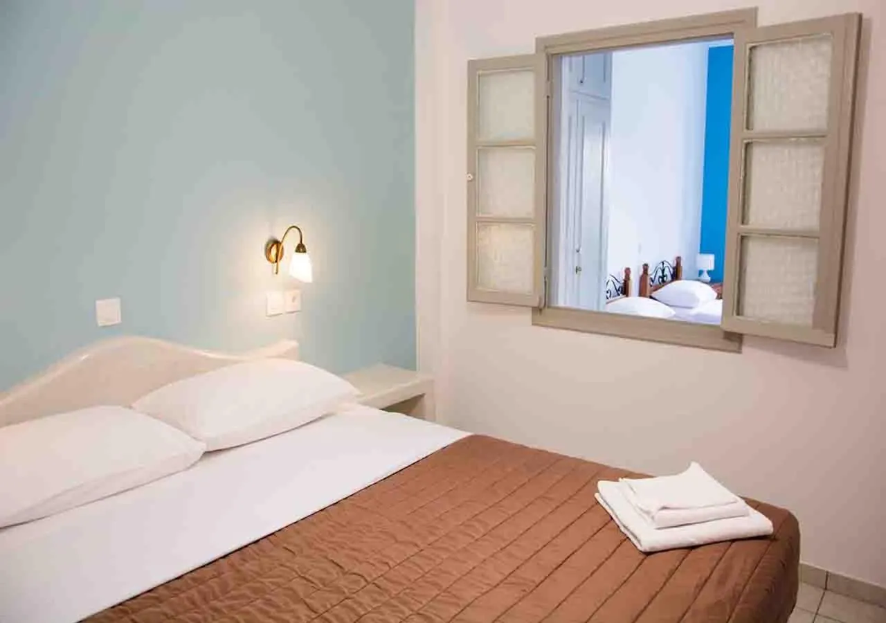 Bed in Sail Inn Studios & Apartments