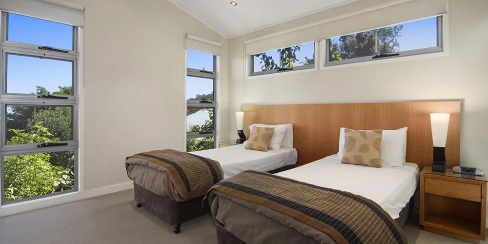 Bed in O'Reilly's Rainforest Retreat