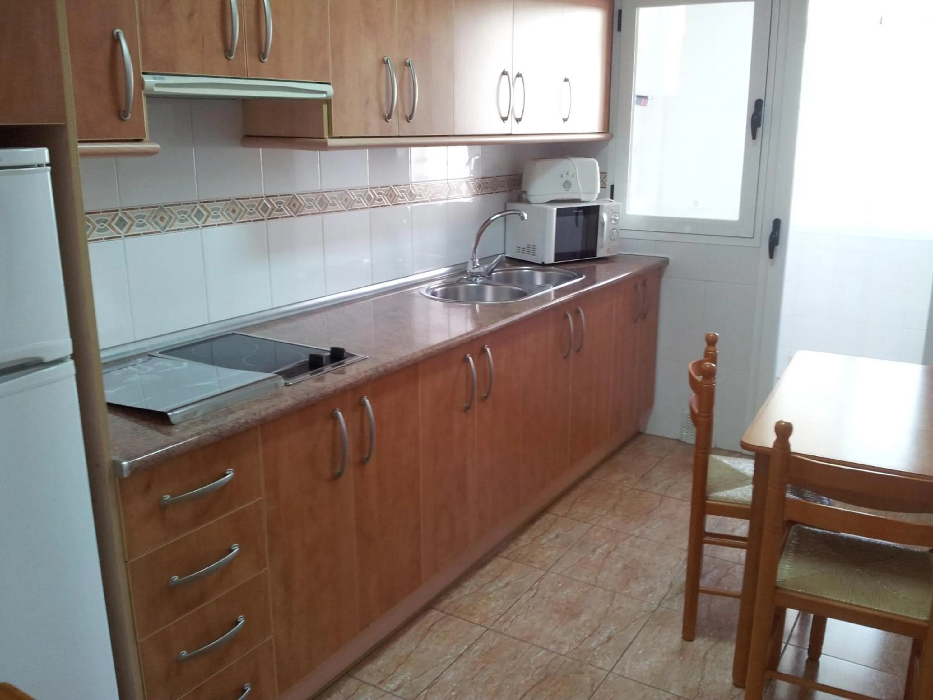 Kitchen or kitchenette in Apartamentos Maracay