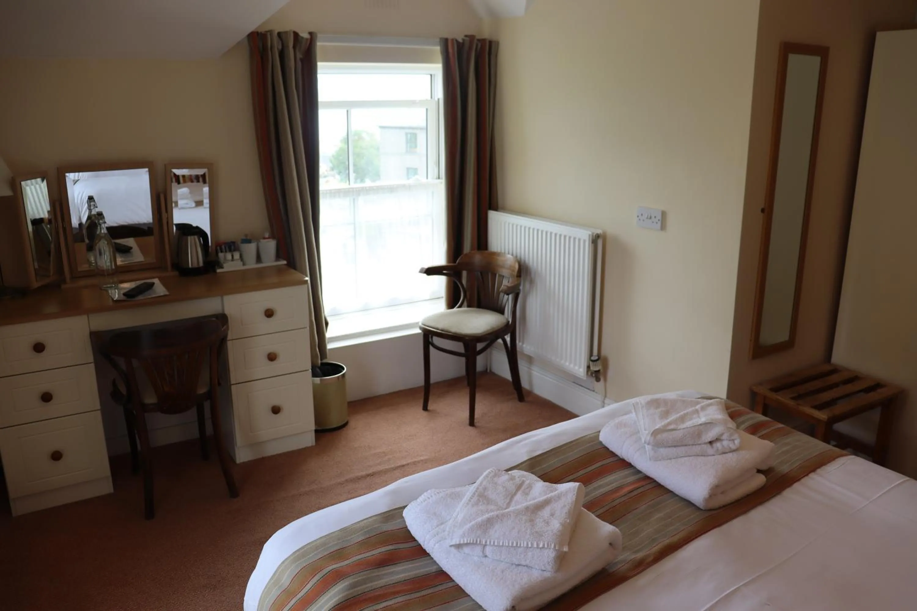 Bed in Lion Hotel & Studio Apartments