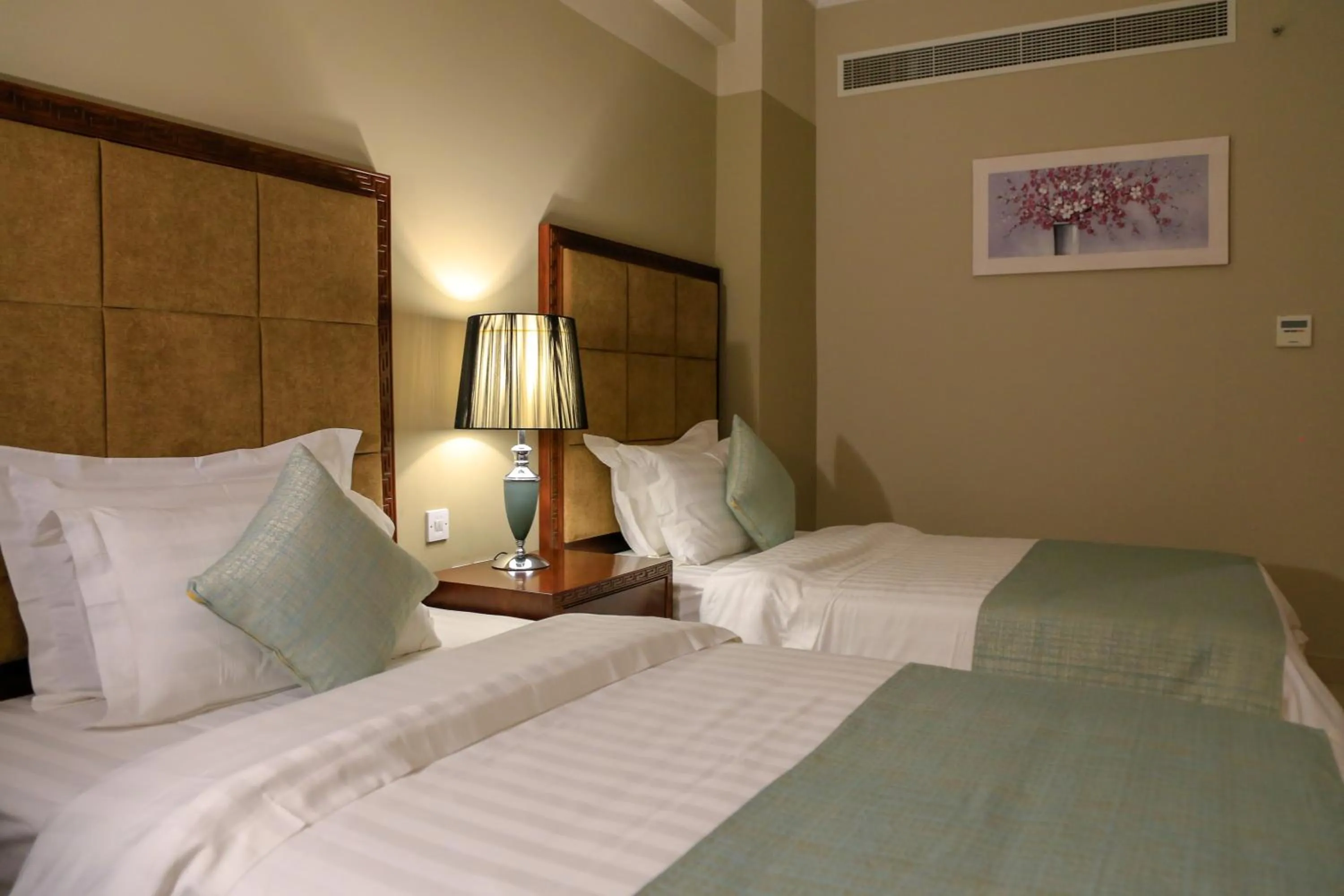 Bed in Muscat Inn Hotel