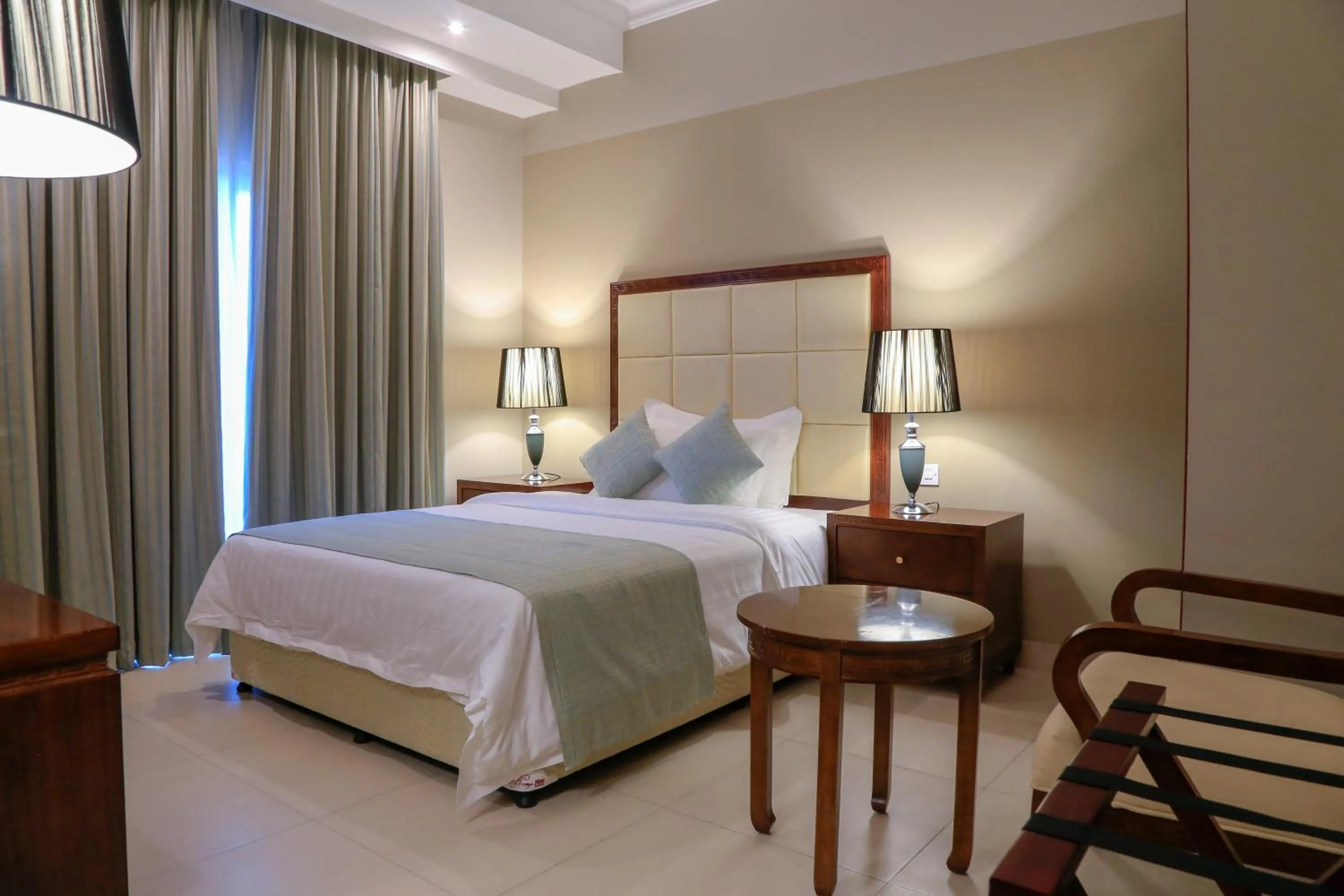 Bed in Muscat Inn Hotel