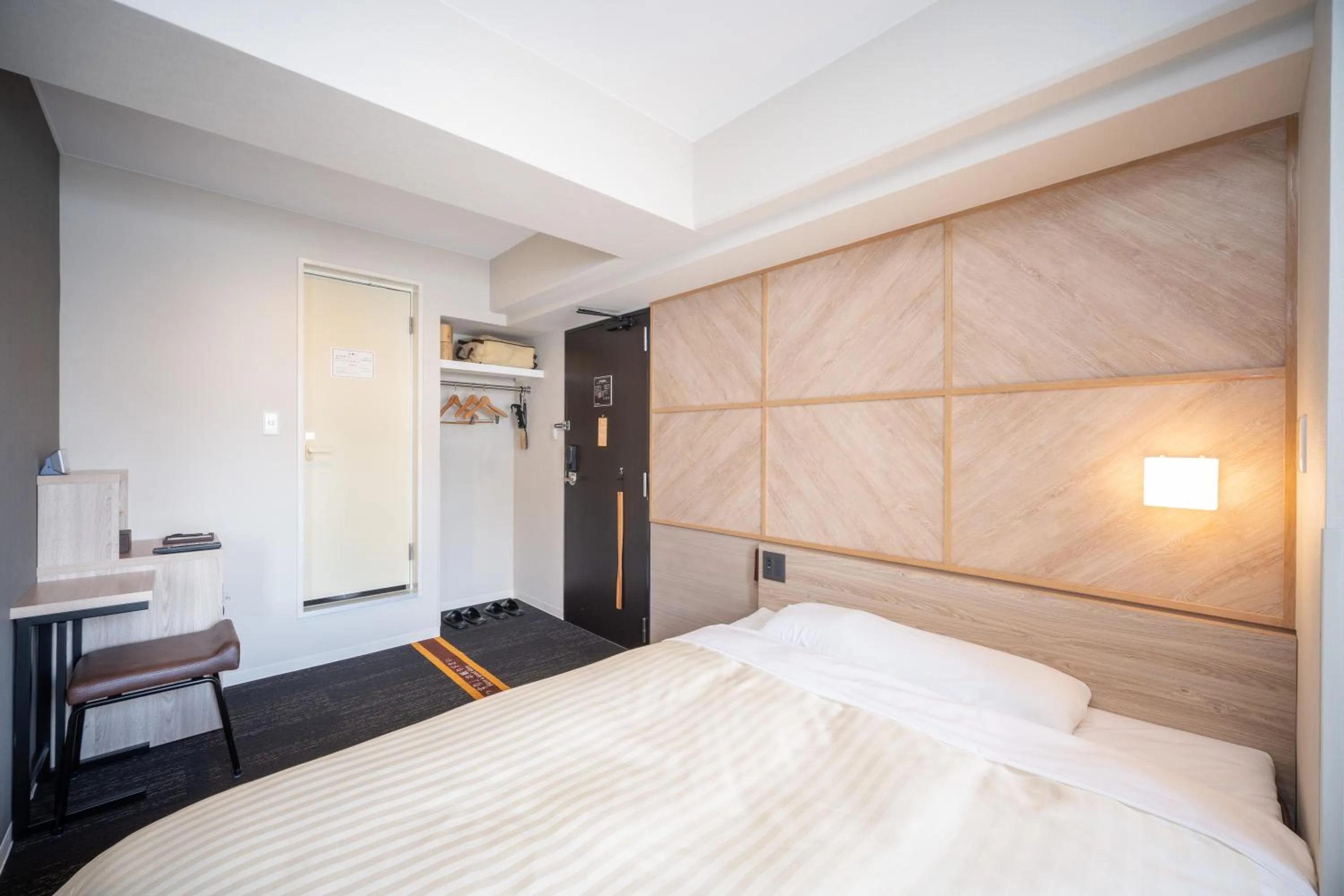 Bed in Super Hotel Kobe