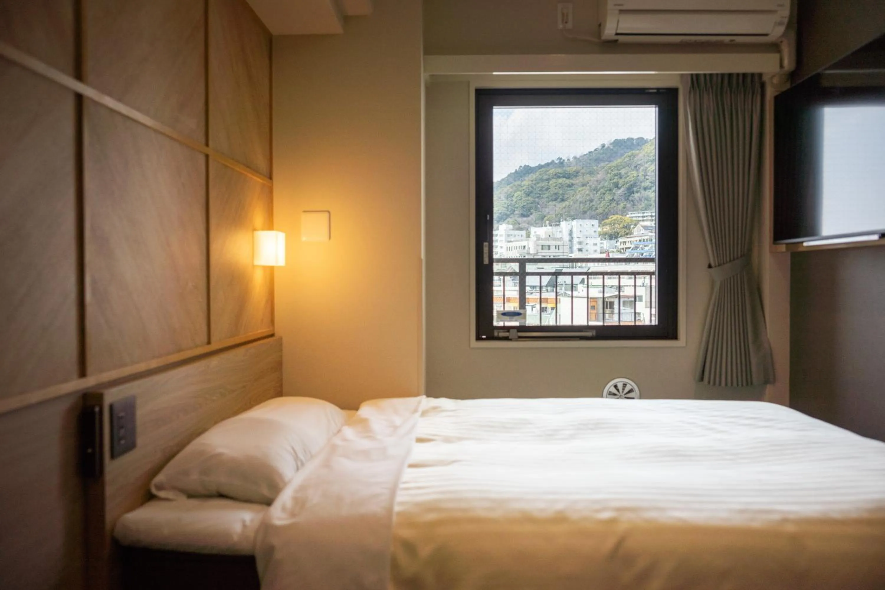 Bed in Super Hotel Kobe