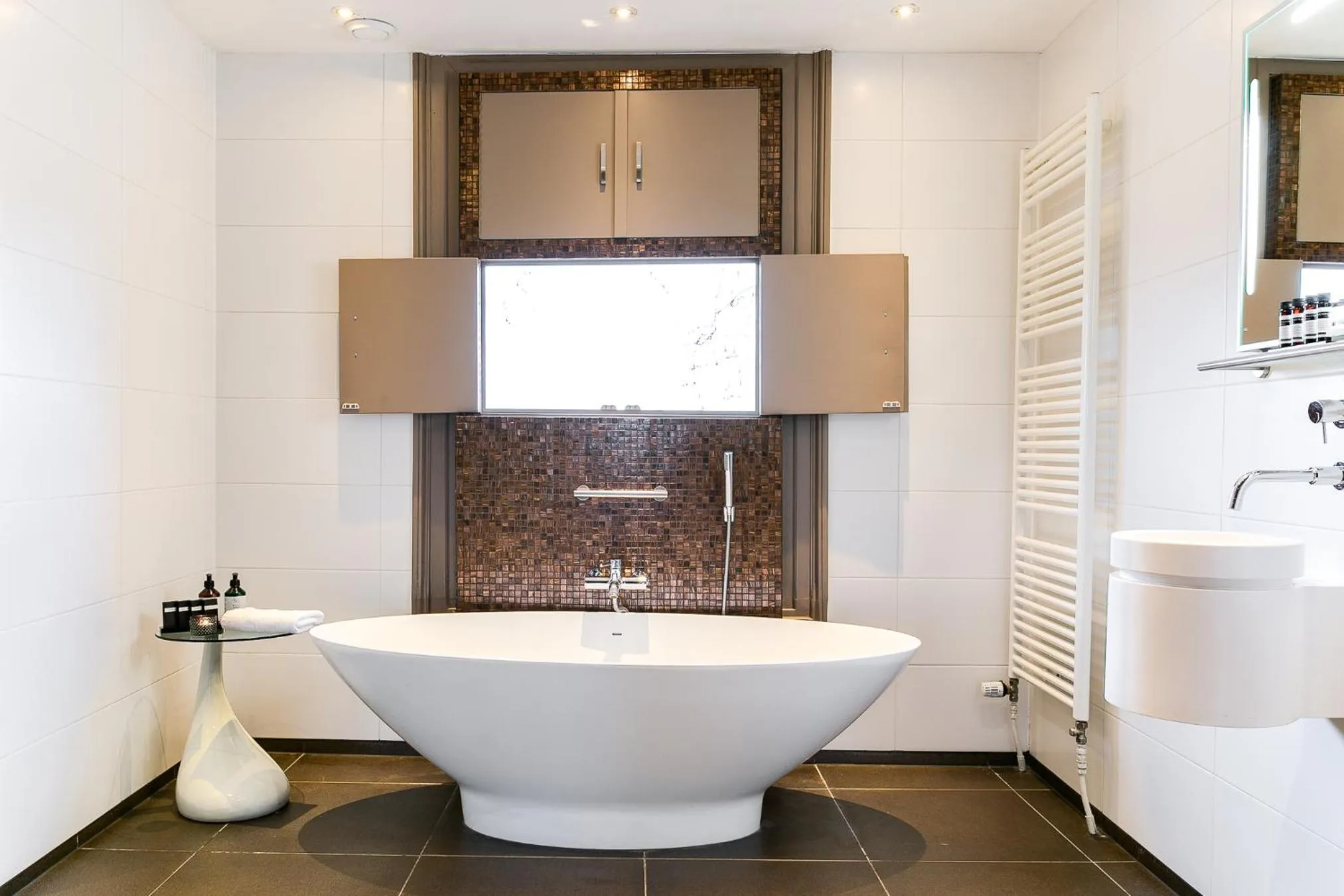 Bathroom in Brasss Hotel Suites