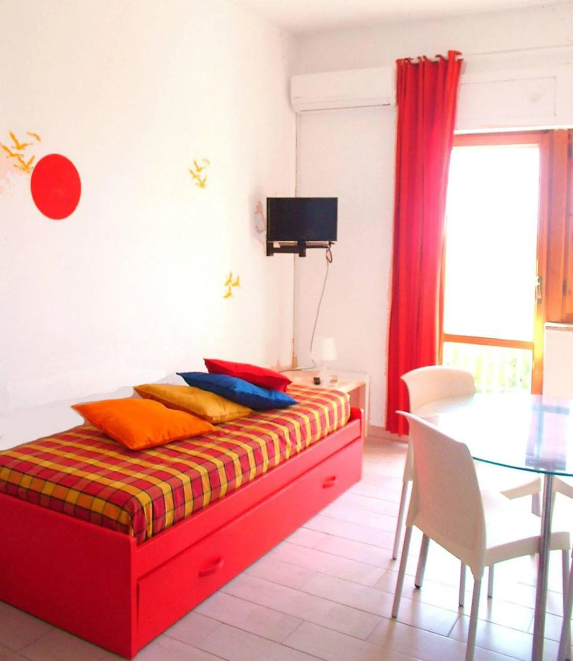 Living room, Bed in Residence La Giungla