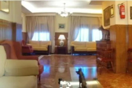 Communal lounge/ TV room in Hotel Alfar