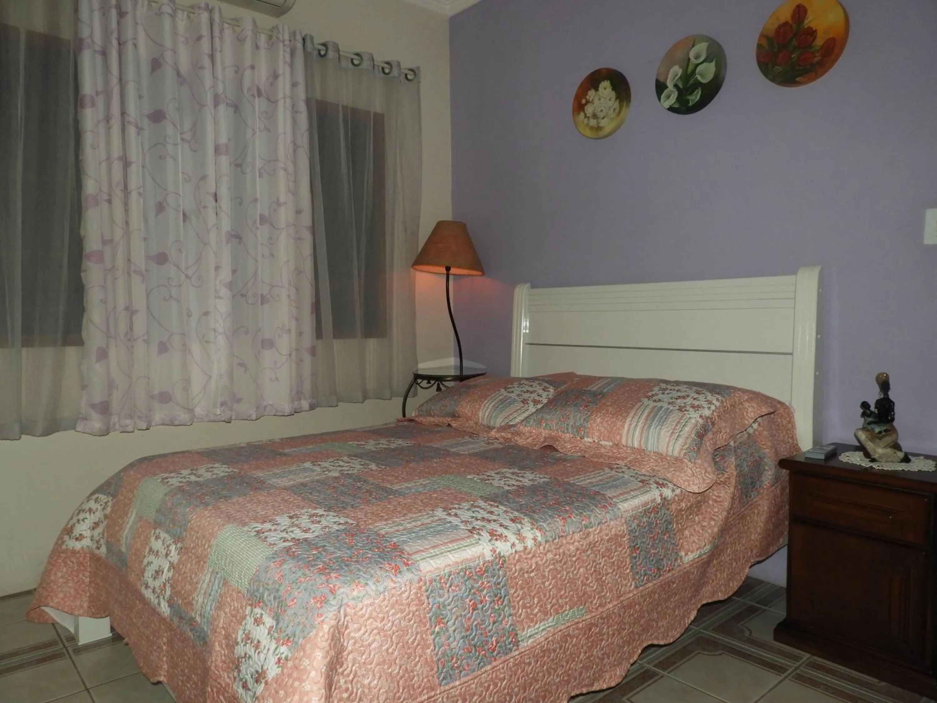 Bed in ACIOLY'S BEACH HOUSE