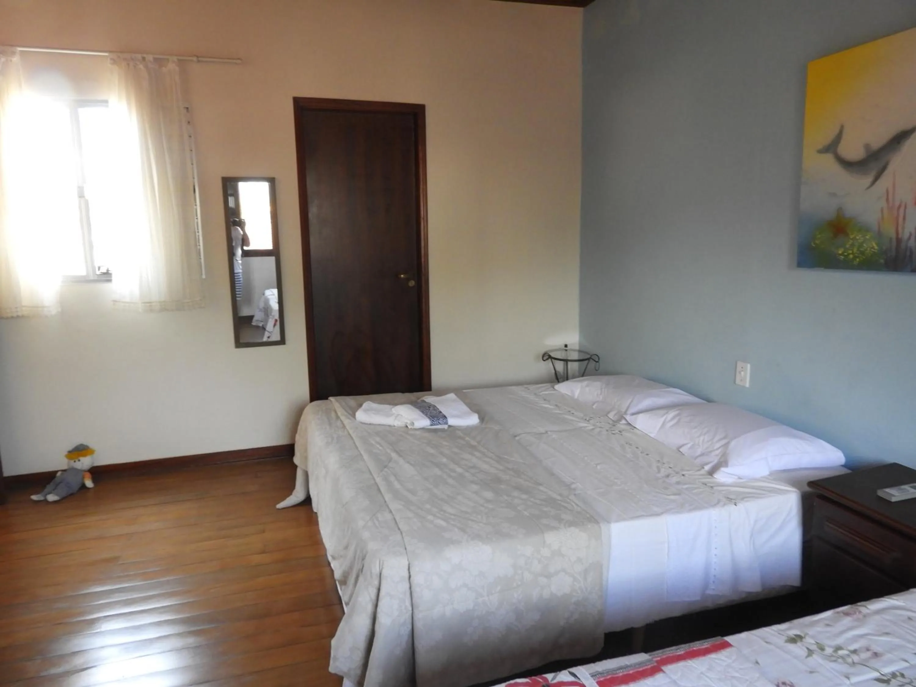 Bed in ACIOLY'S BEACH HOUSE