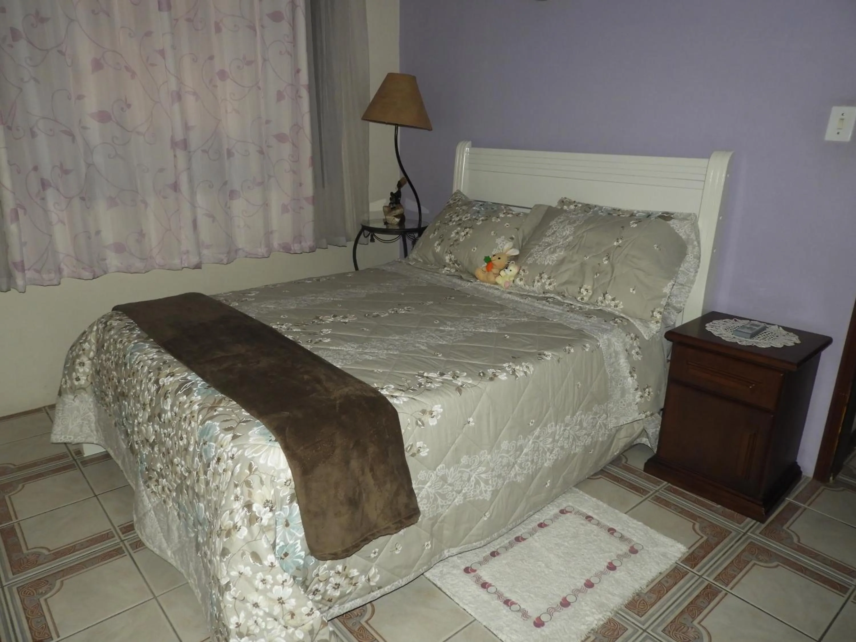 Bed in ACIOLY'S BEACH HOUSE