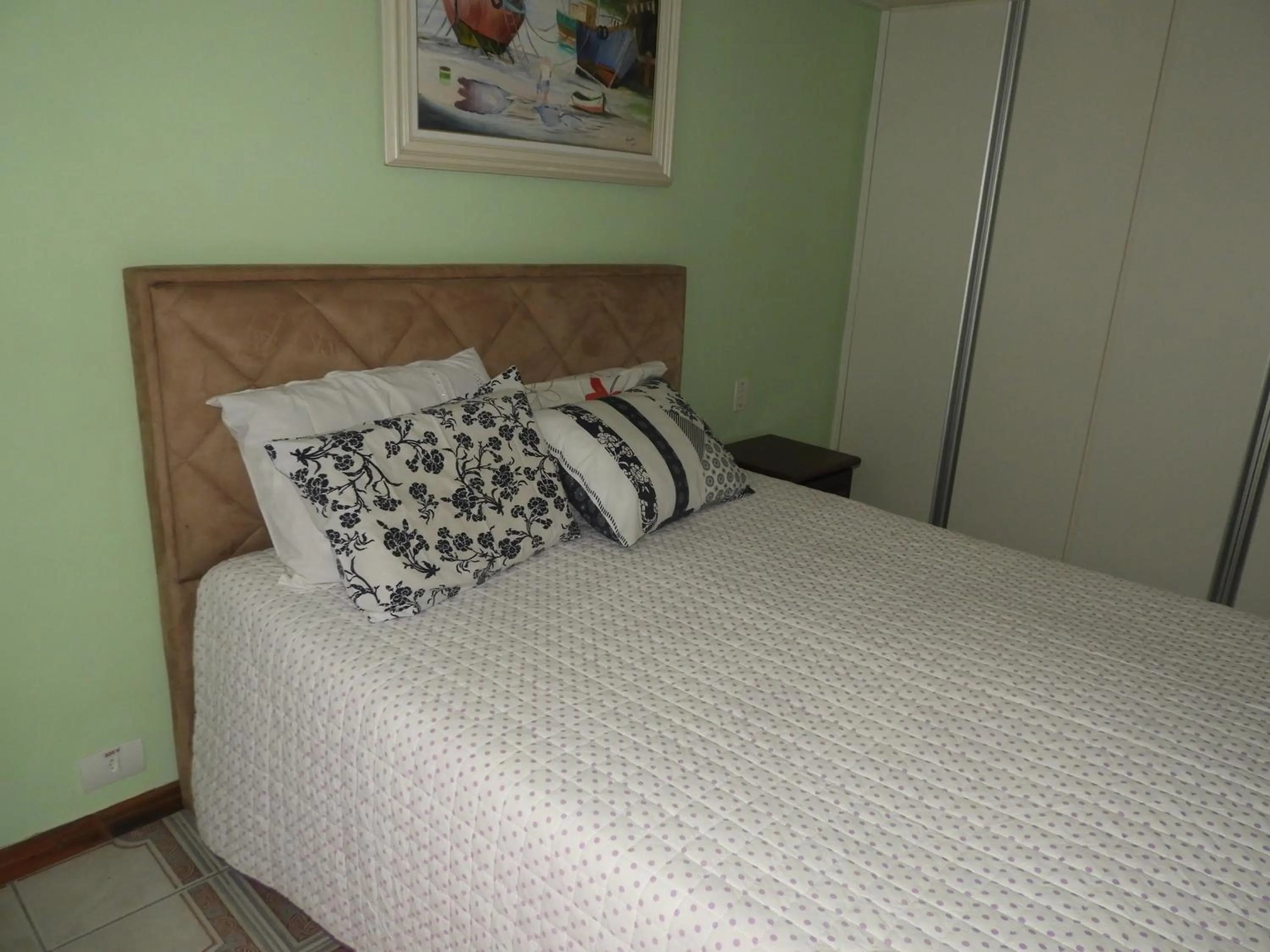 Bed in ACIOLY'S BEACH HOUSE