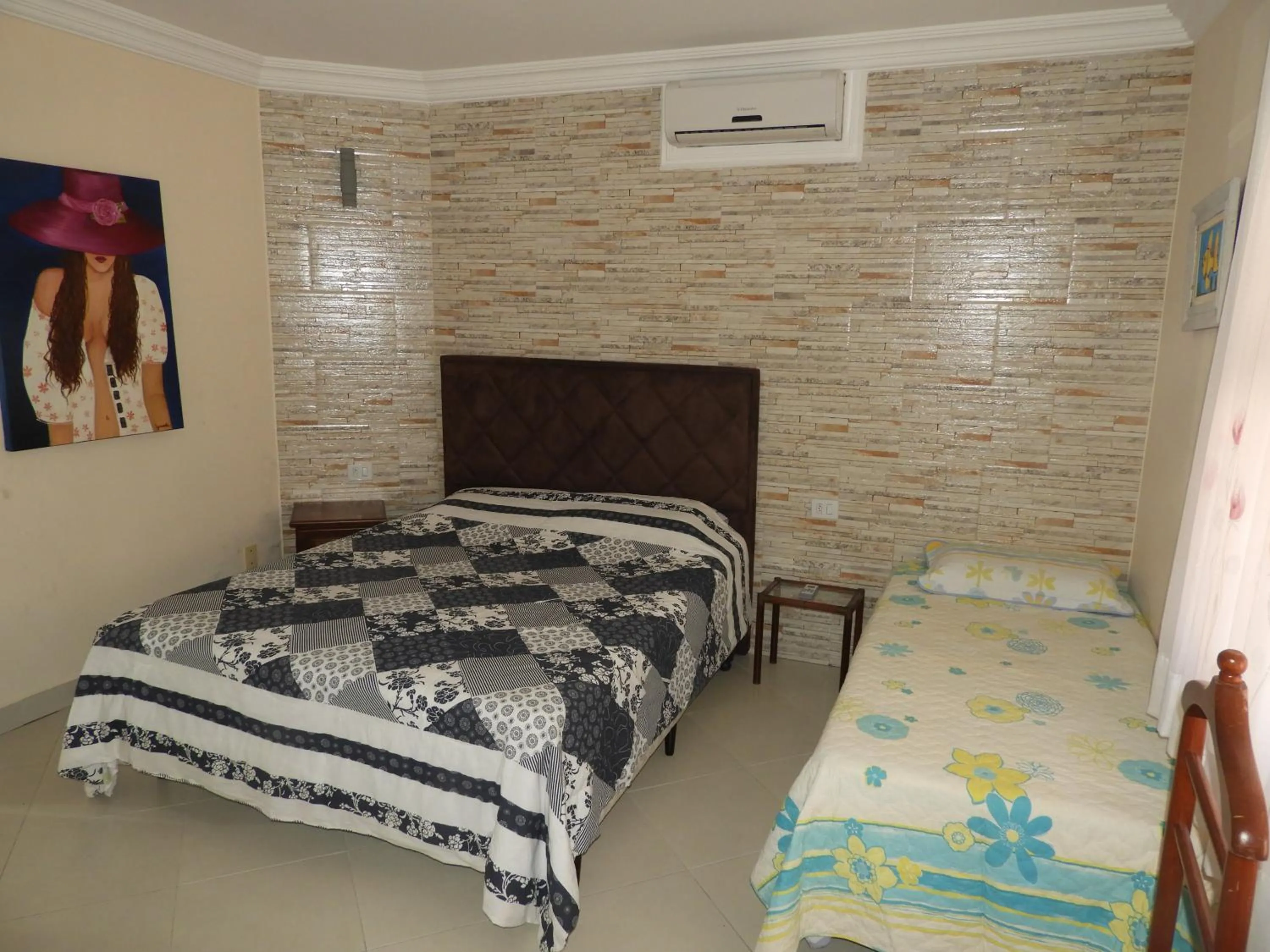 Bed in ACIOLY'S BEACH HOUSE