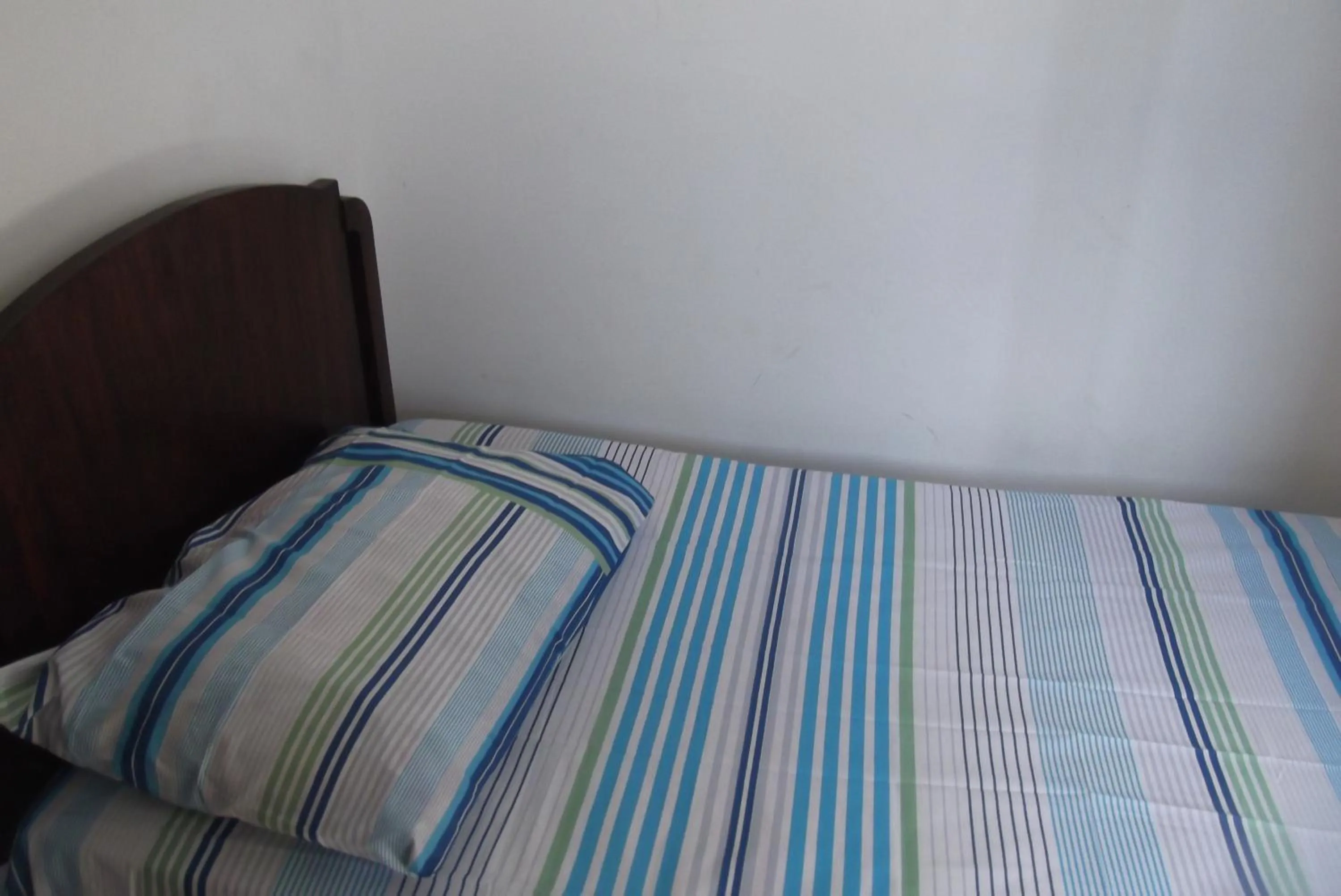 Bed in Tião Botelho Guest House