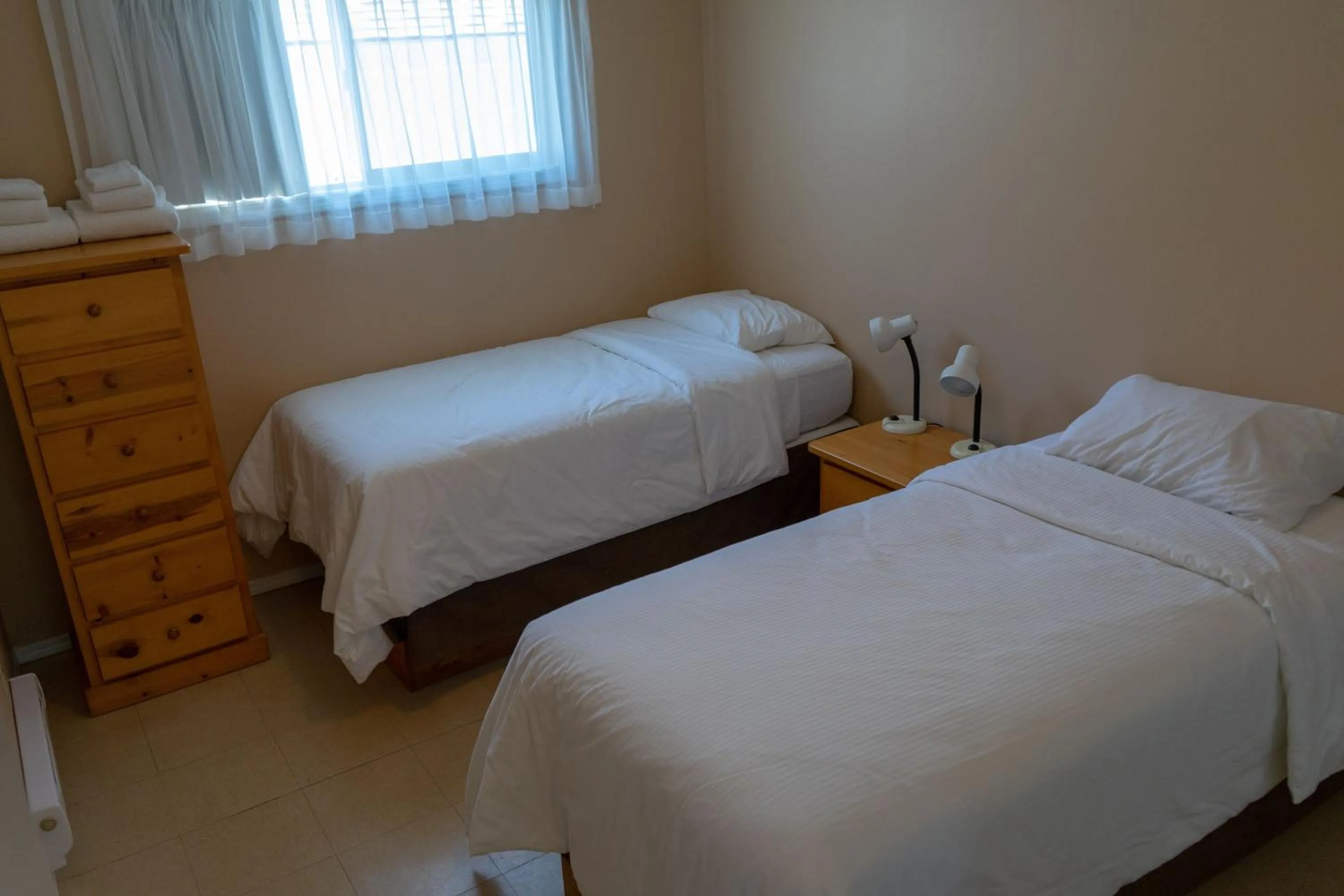 Bed in Sandy Beach Suites