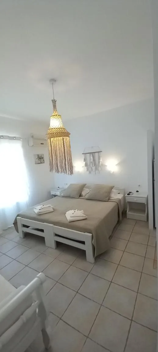 Bed in Anixis Studios Aliki Paros