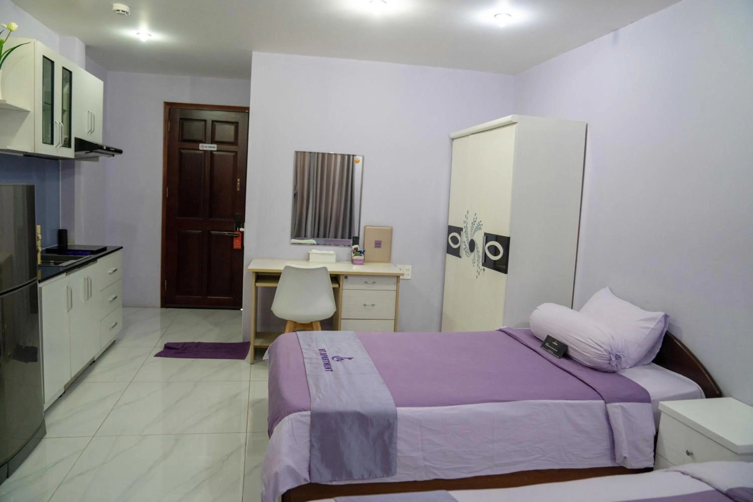 Bed in HT Hotel Apartment