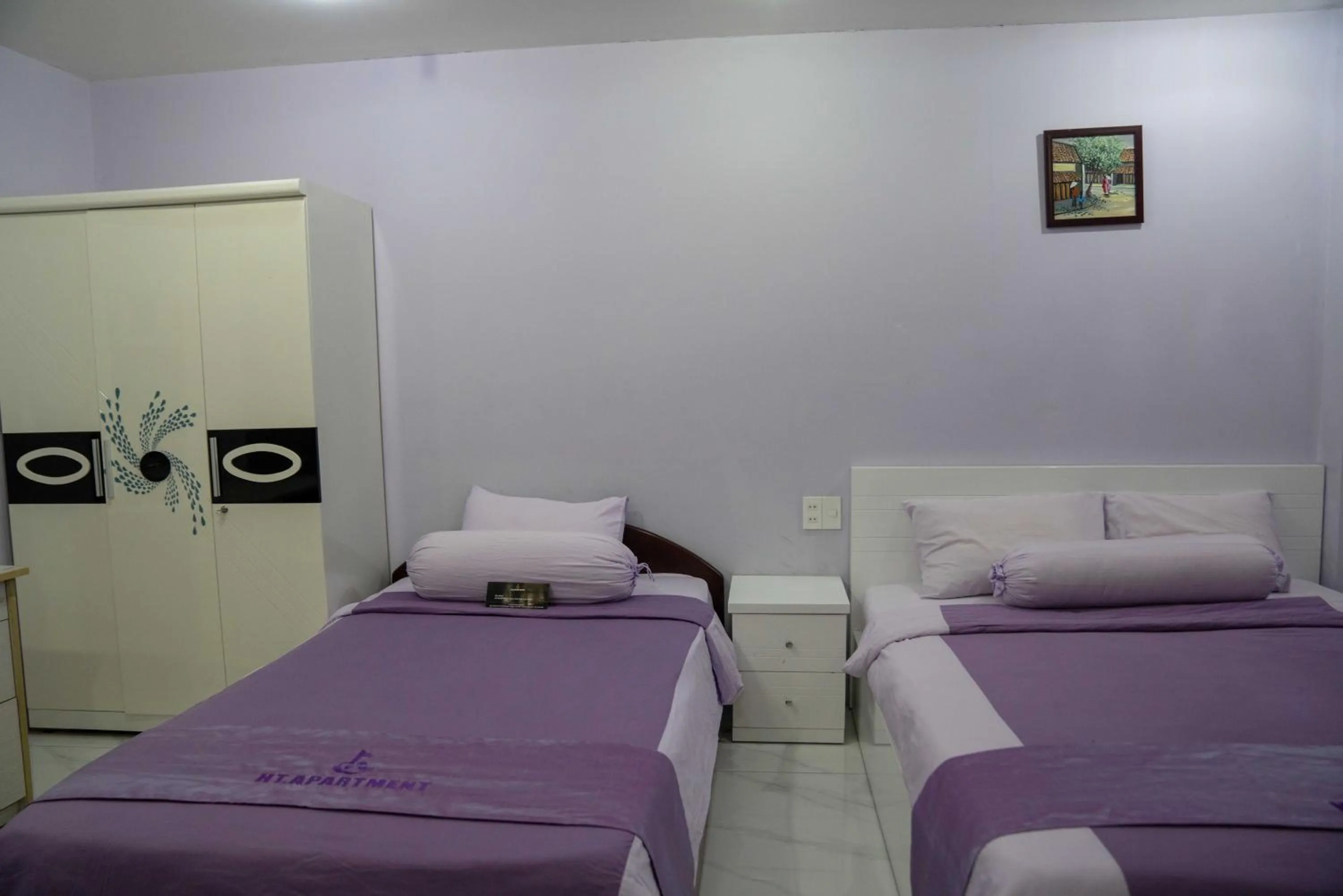 Bed in HT Hotel Apartment