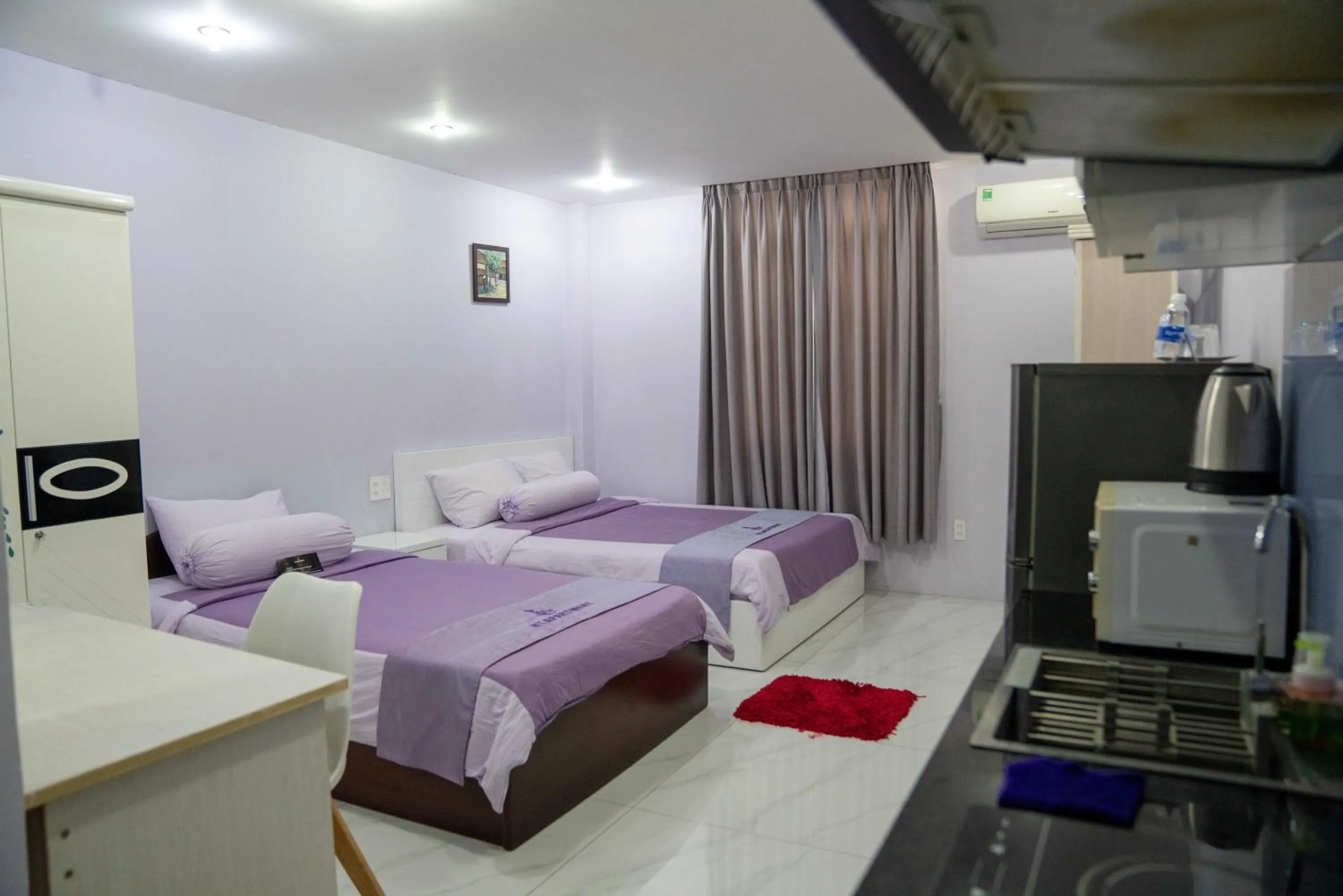 Bed in HT Hotel Apartment