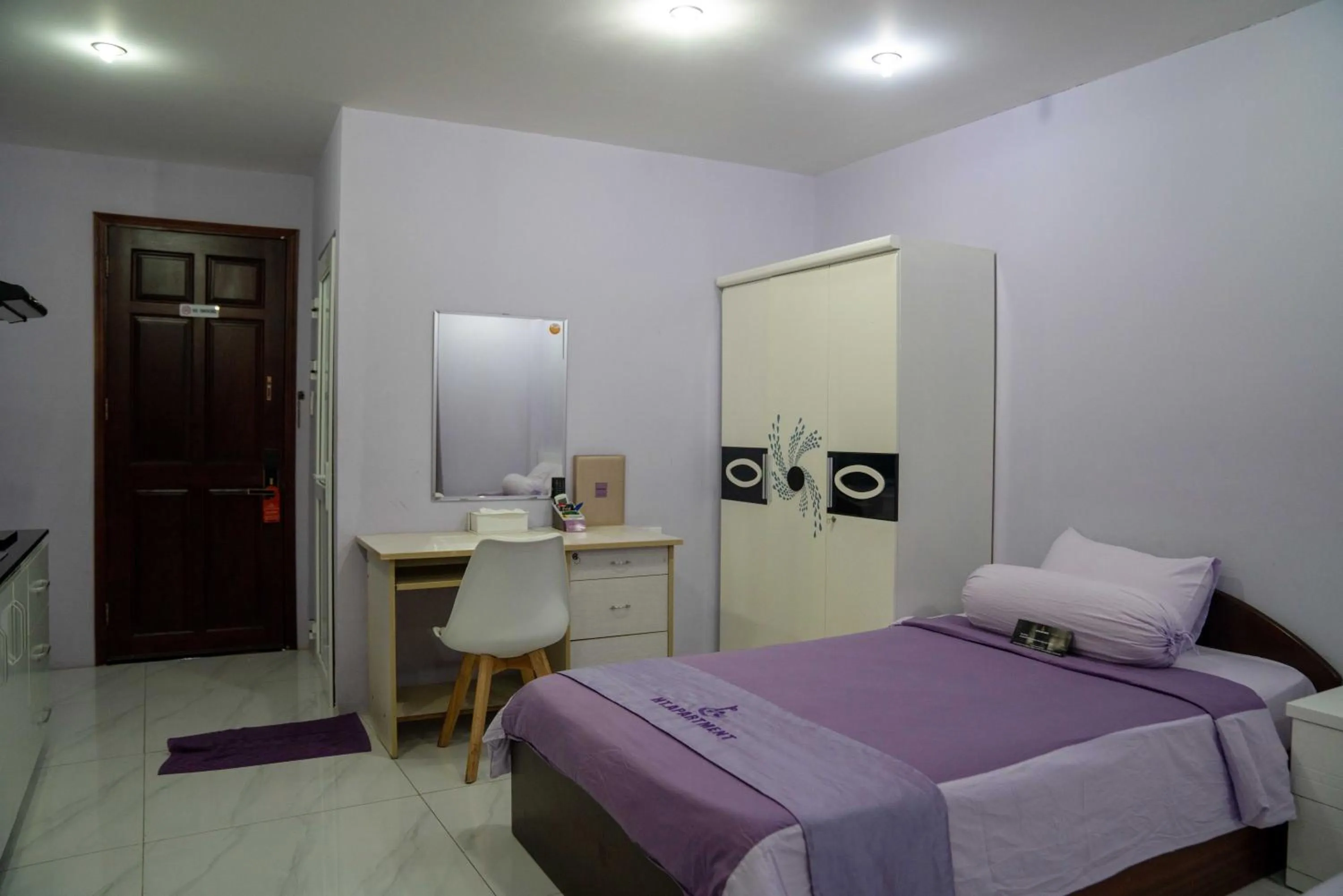 Bed in HT Hotel Apartment