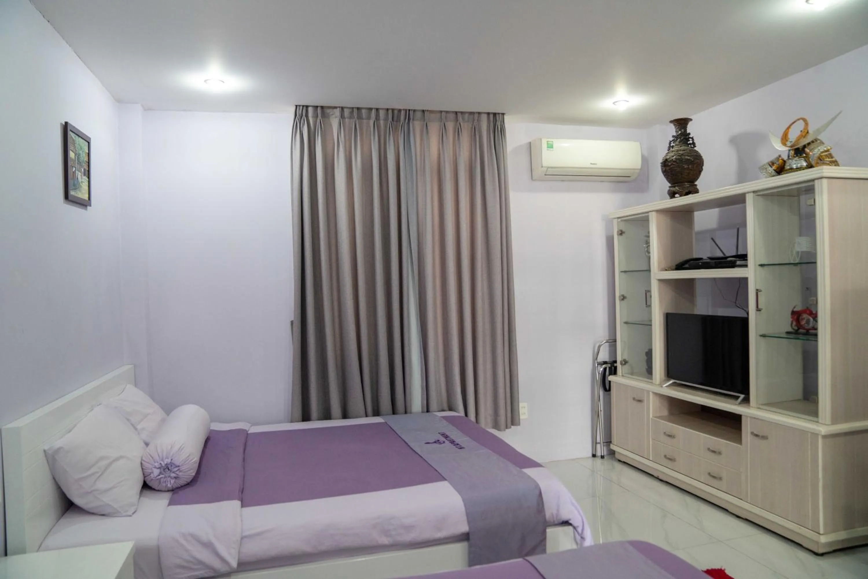 Bed in HT Hotel Apartment