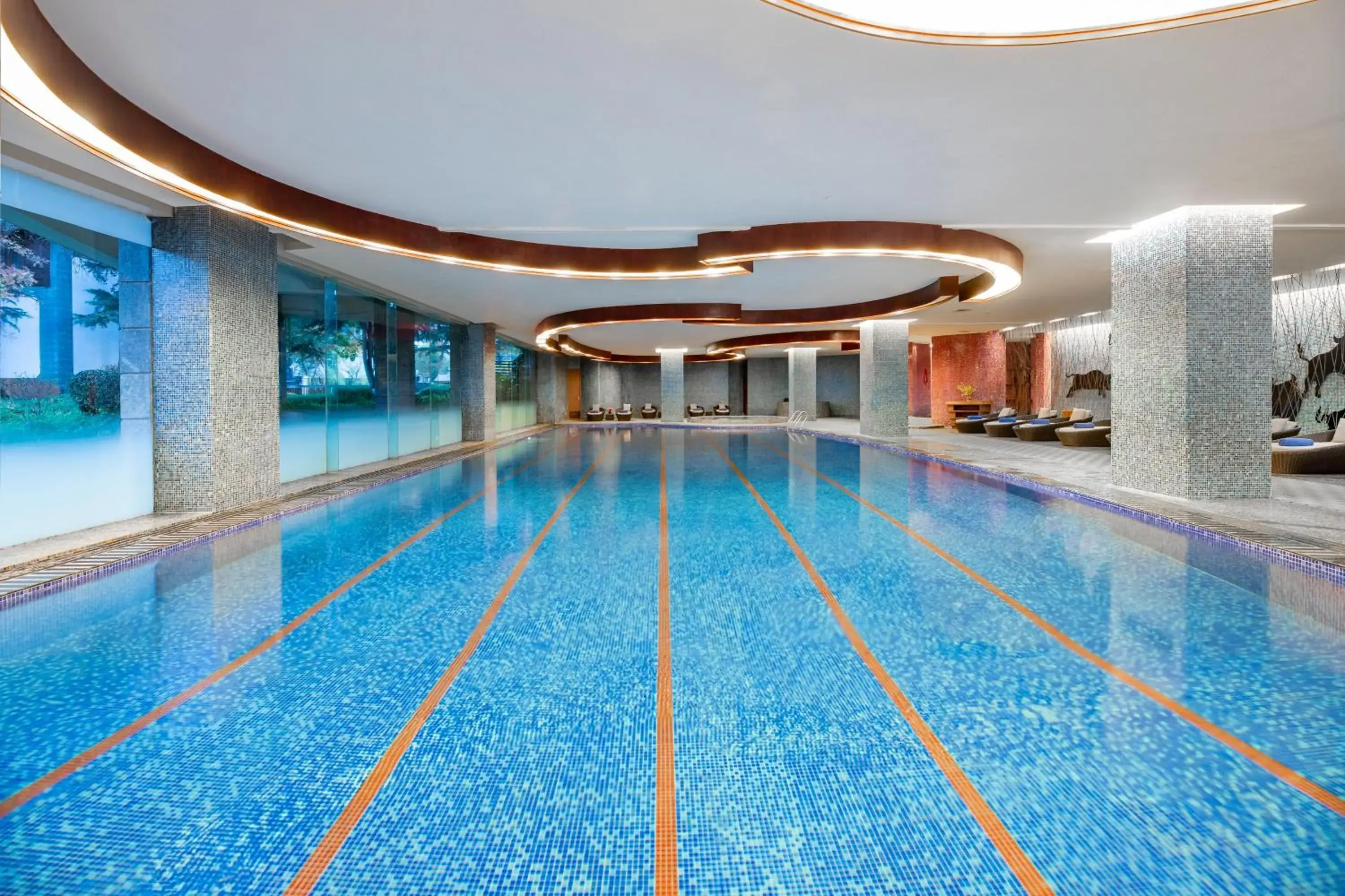 Swimming pool in InterContinental Lijiang Ancient Town Resort by IHG Swimming pool in InterContinental Lijiang Ancient Town Resort by IHG