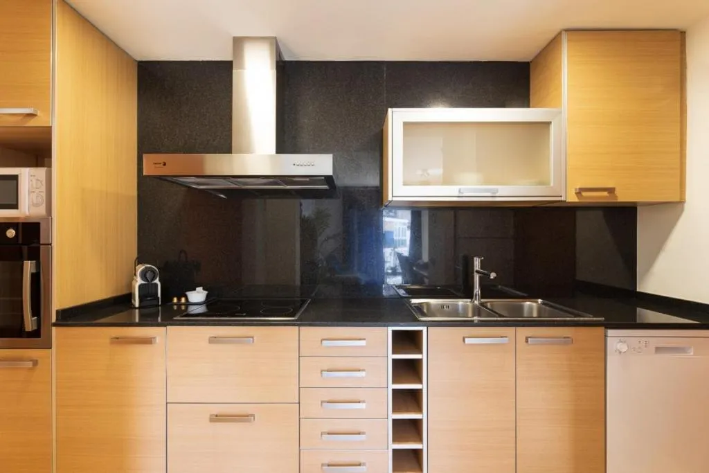 kitchen in Lucas House Apartments by Sitges Group
