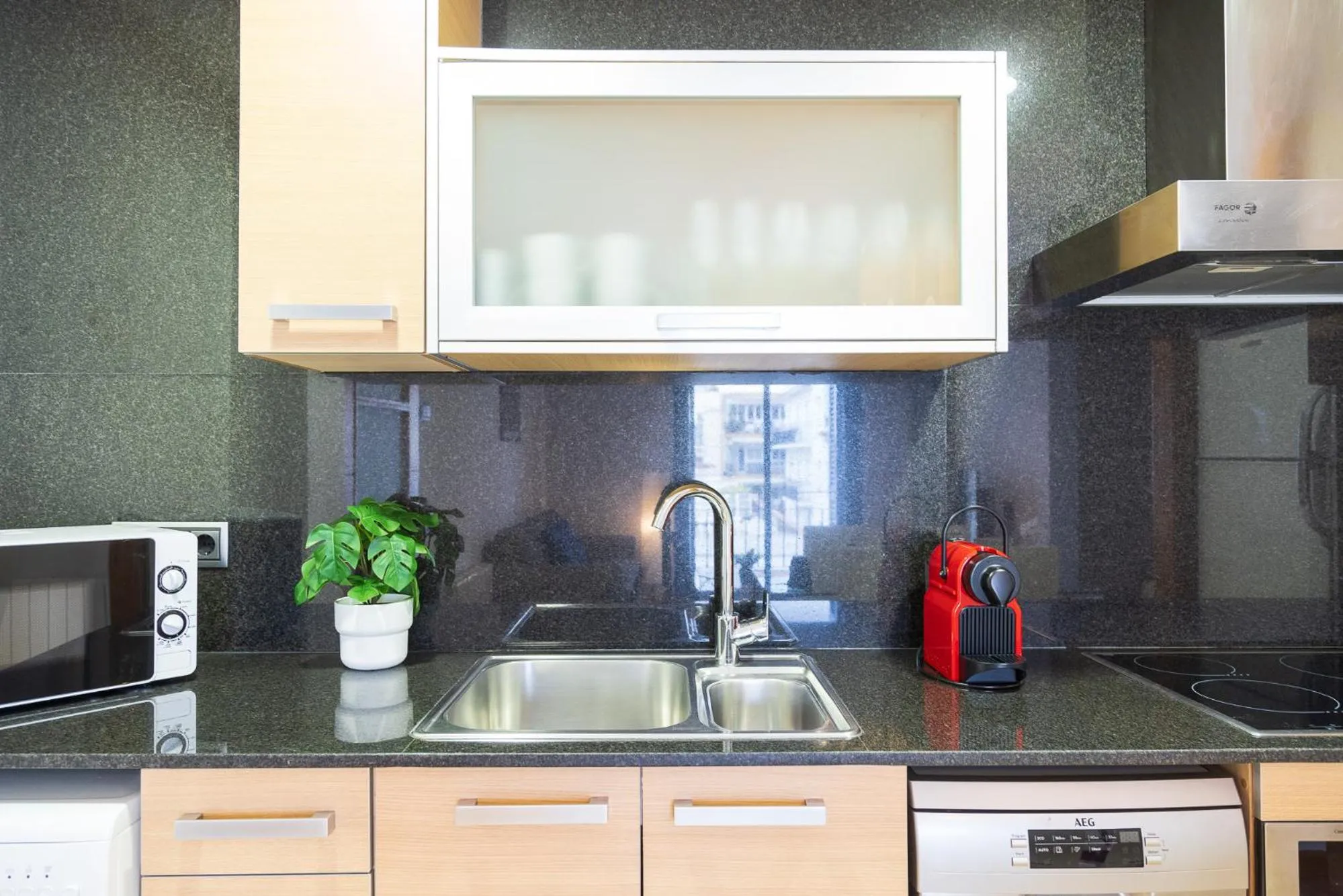 Kitchen or kitchenette in Lucas House Apartments by Sitges Group