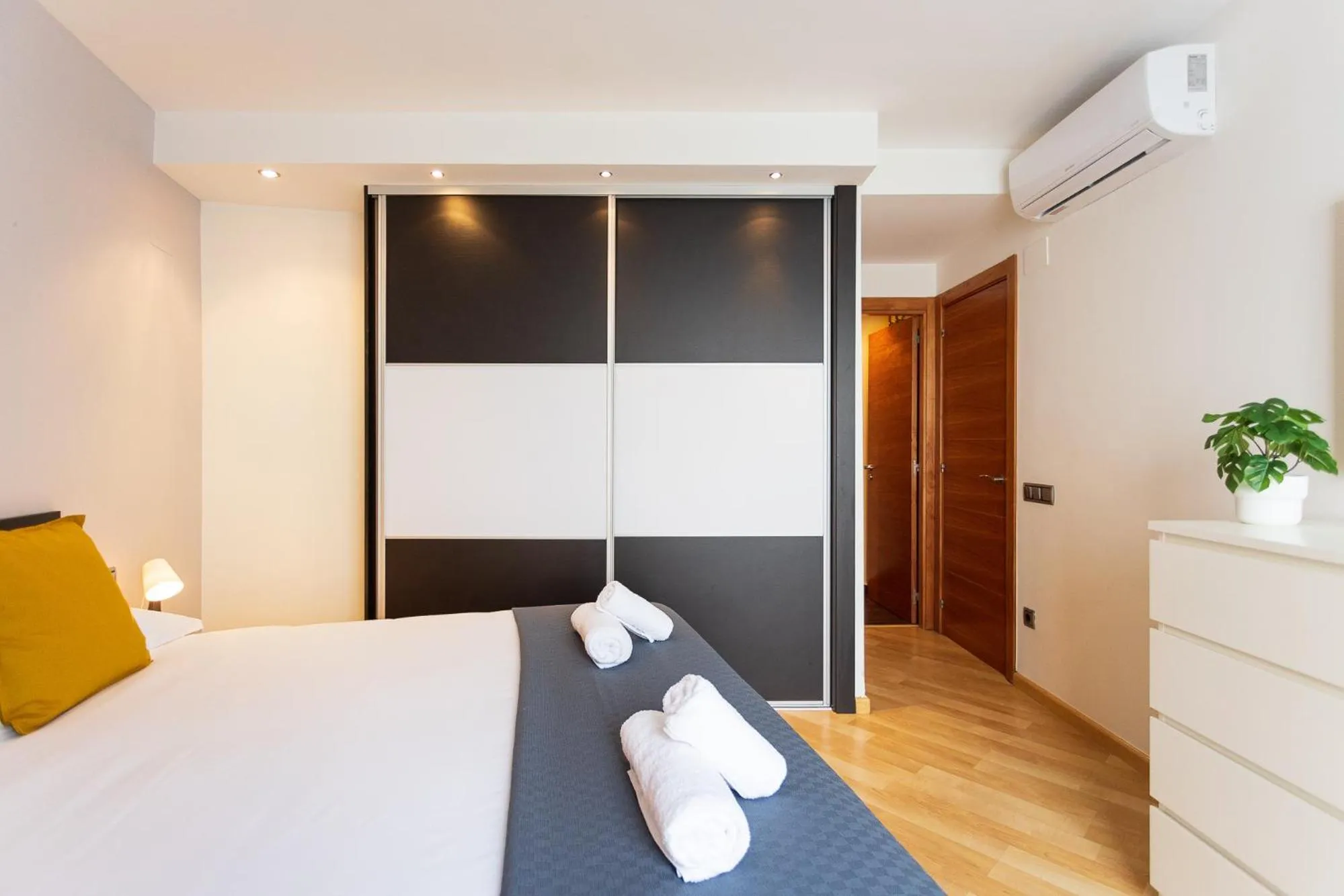 Bed in Lucas House Apartments by Sitges Group