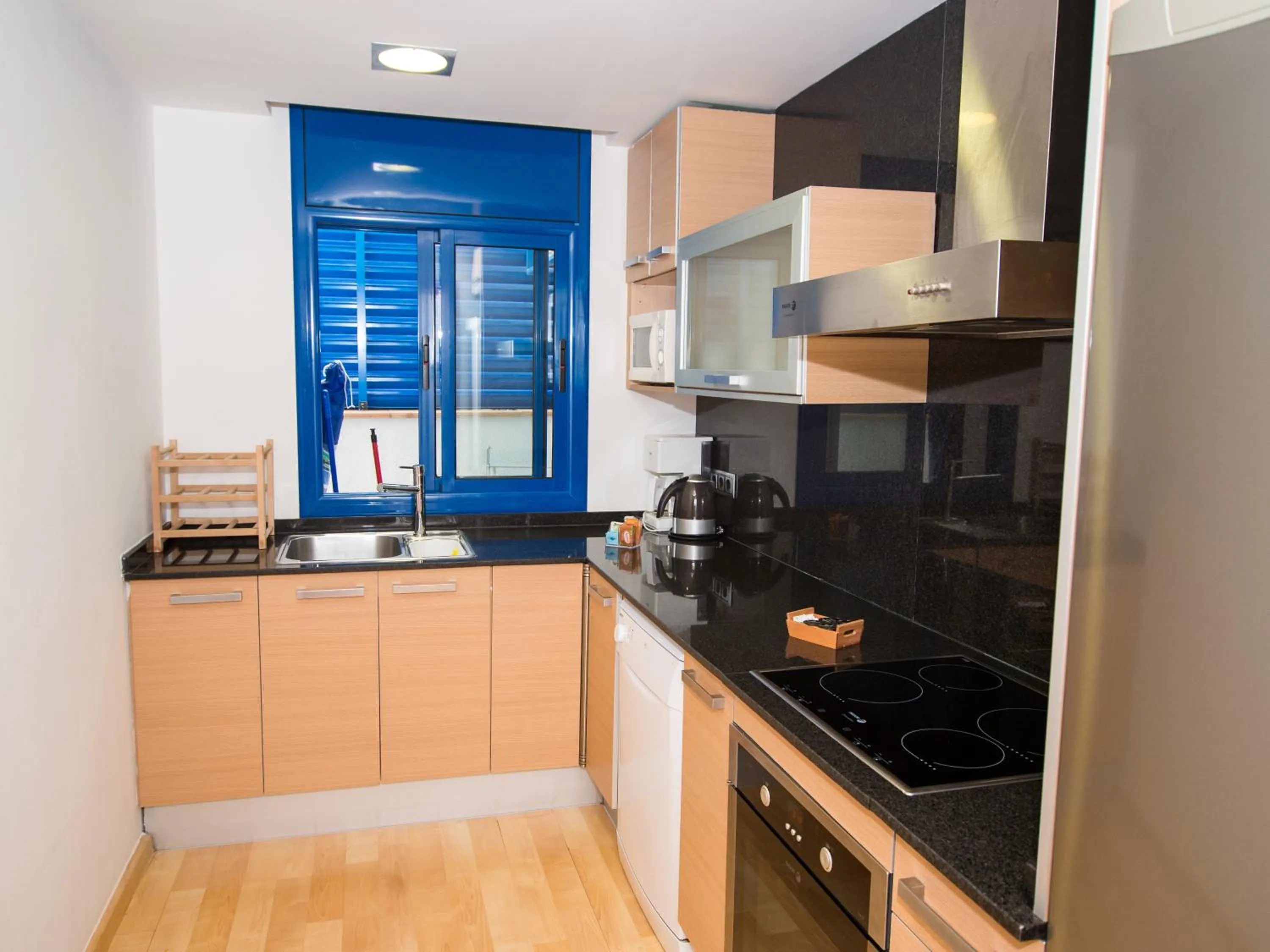 Kitchen or kitchenette in Lucas House Apartments by Sitges Group