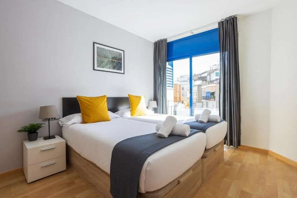 Bed in Lucas House Apartments by Sitges Group