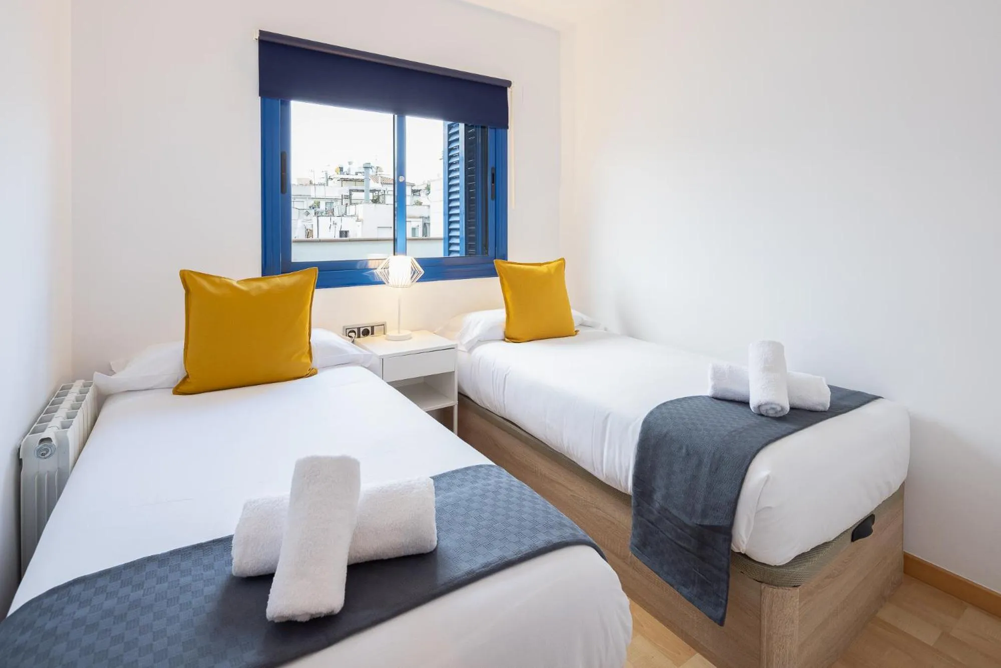 Bed in Lucas House Apartments by Sitges Group