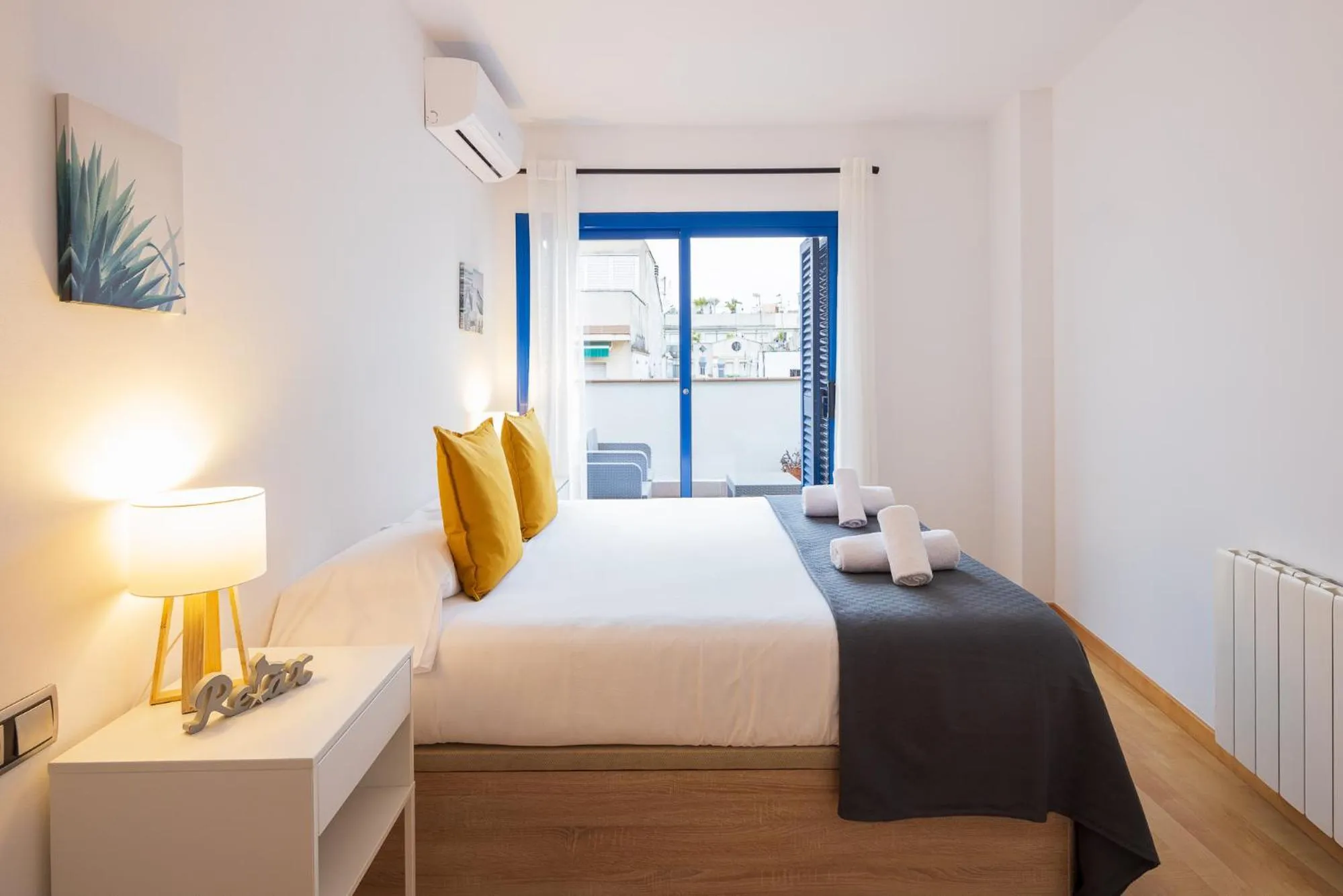 Bed in Lucas House Apartments by Sitges Group