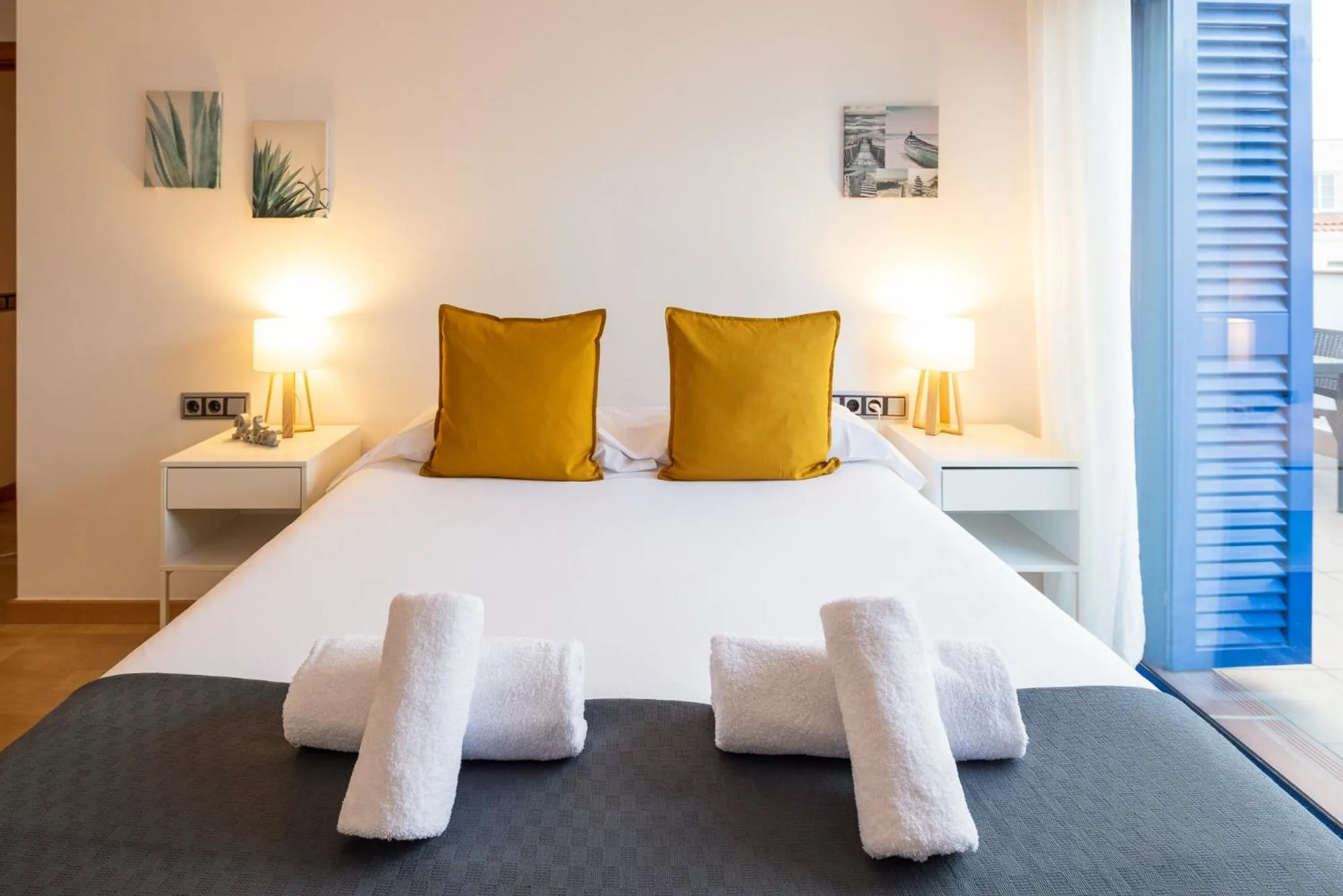 Bed in Lucas House Apartments by Sitges Group