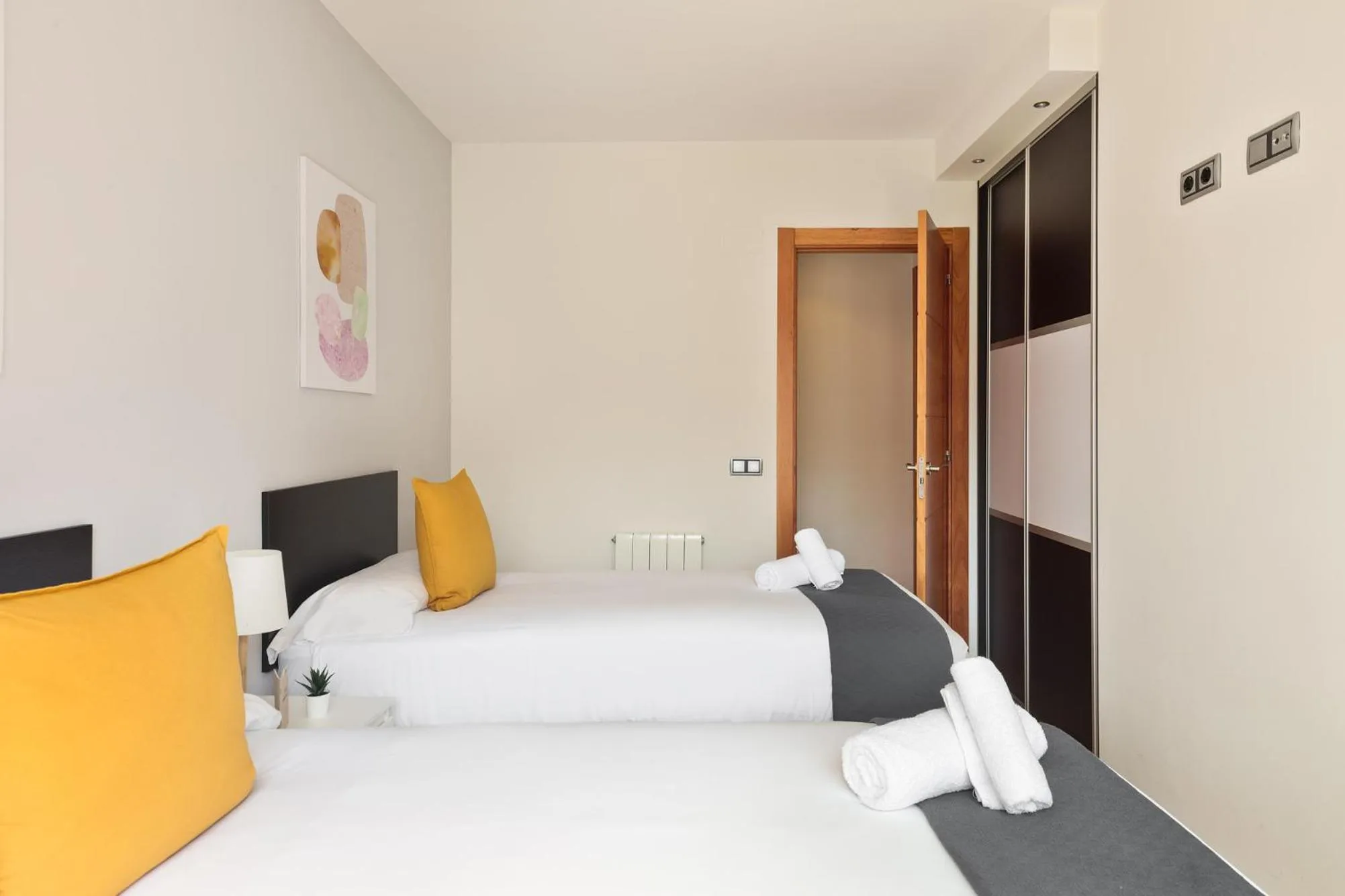 Bed in Lucas House Apartments by Sitges Group