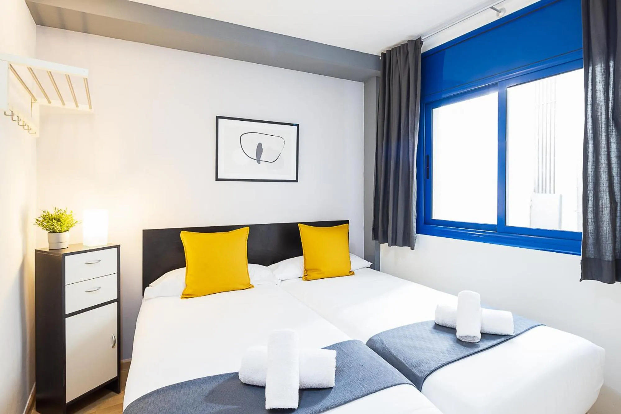 Bed in Lucas House Apartments by Sitges Group