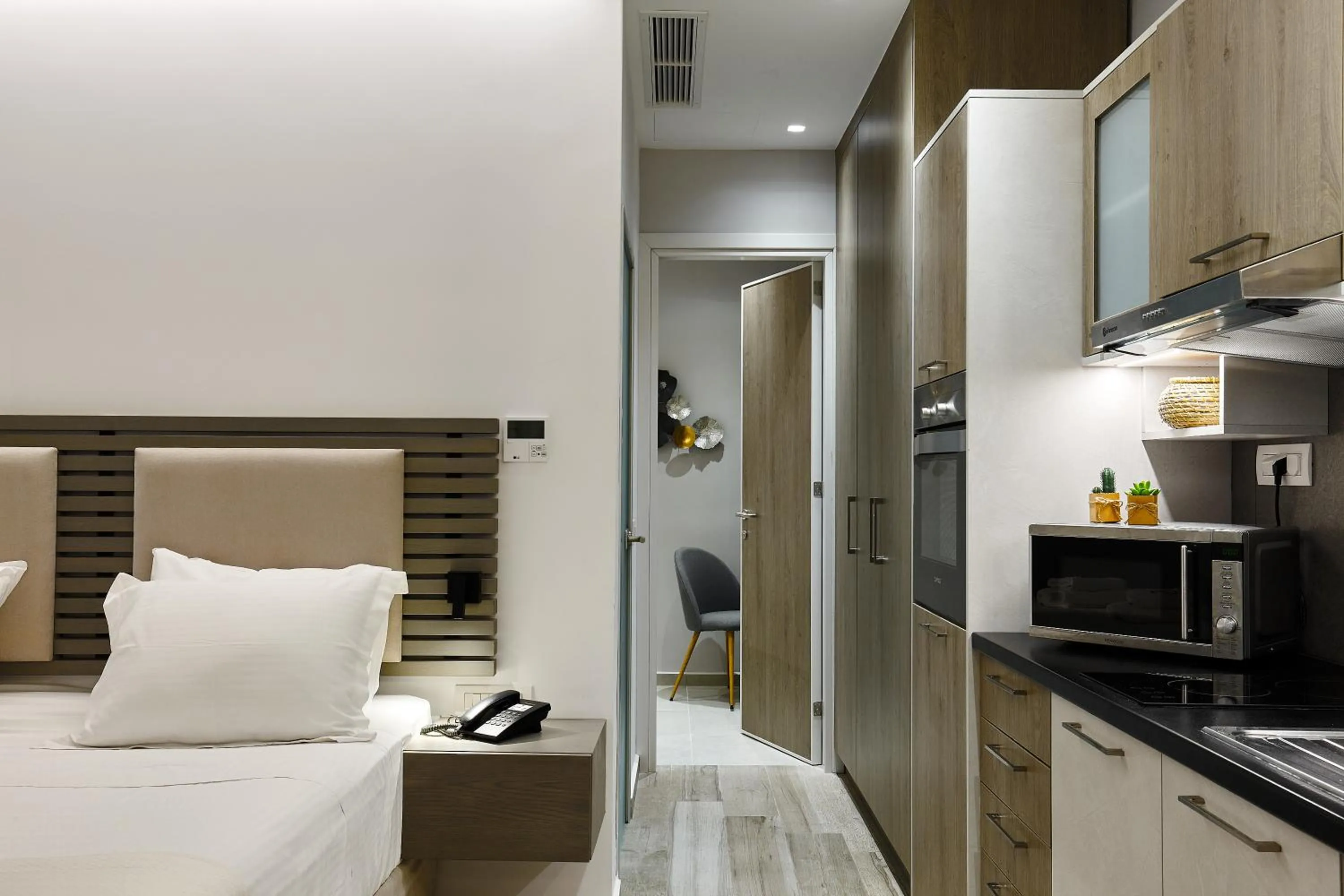 Kitchen or kitchenette, Bed in Seascape Luxury Residences