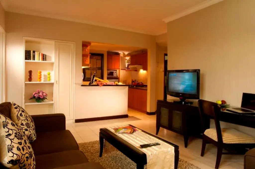 Photo of the whole room, TV/Entertainment Center in Grand Tropic Suites Hotel