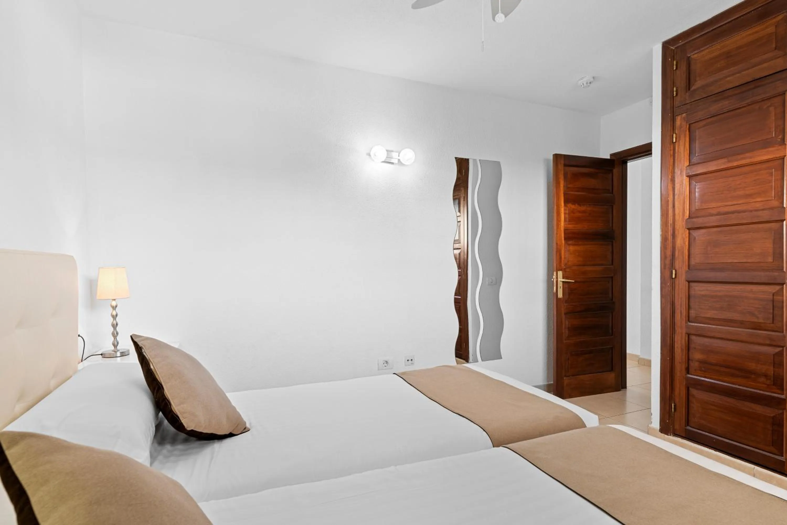 Bed in Paloma Beach Apartments