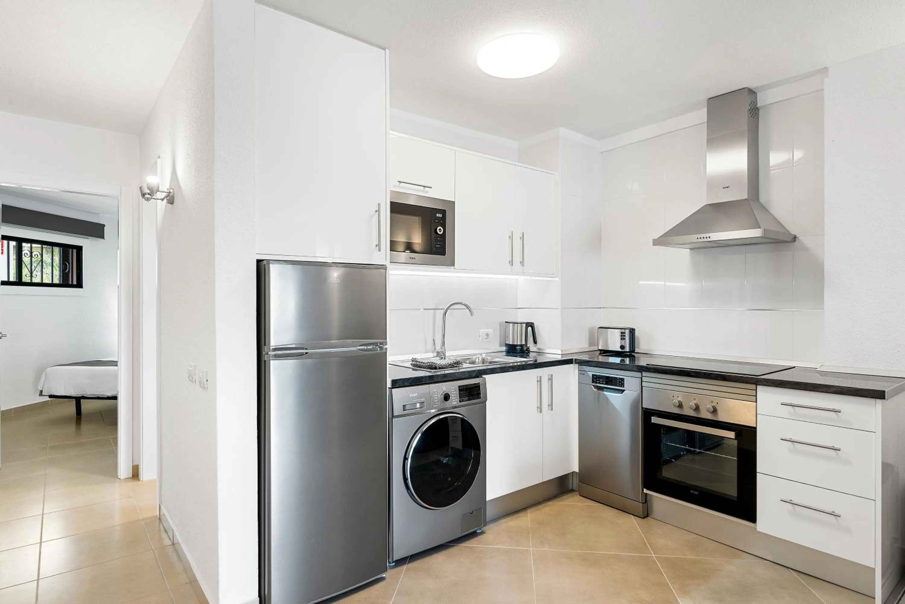 Kitchen or kitchenette in Paloma Beach Apartments