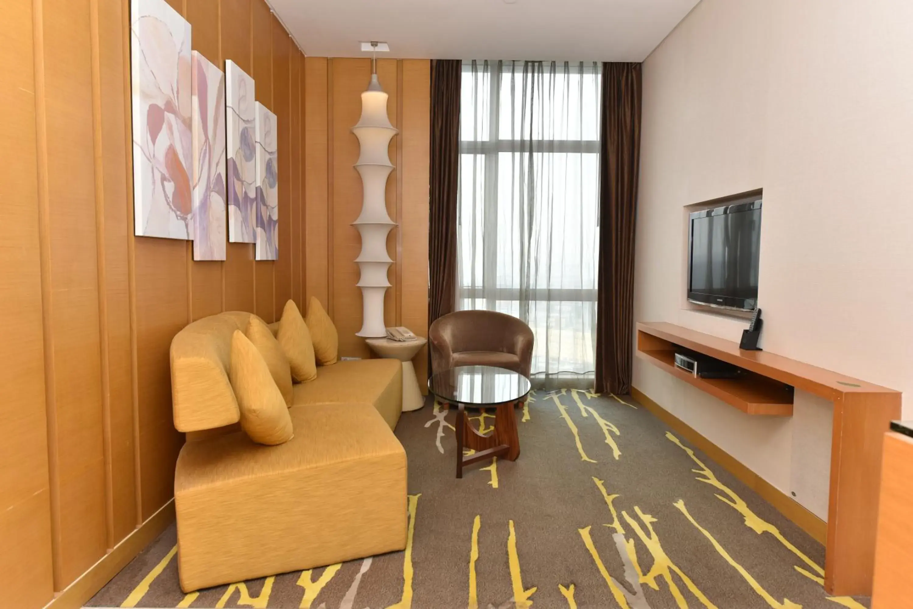 Living room in Crowne Plaza Zhongshan Wing On City by IHG Living room in Crowne Plaza Zhongshan Wing On City by IHG