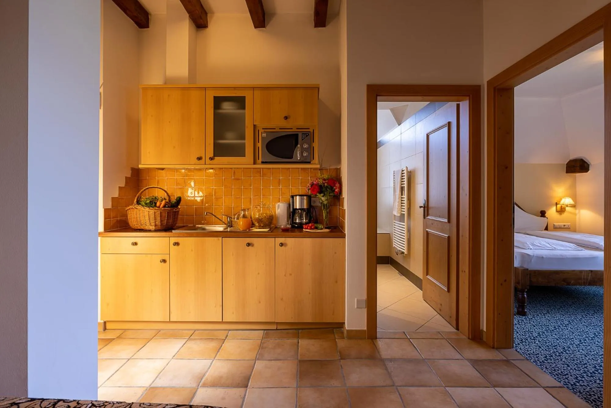 kitchen, Bed in Hotel Finkennest - Panoramic Garden Resort