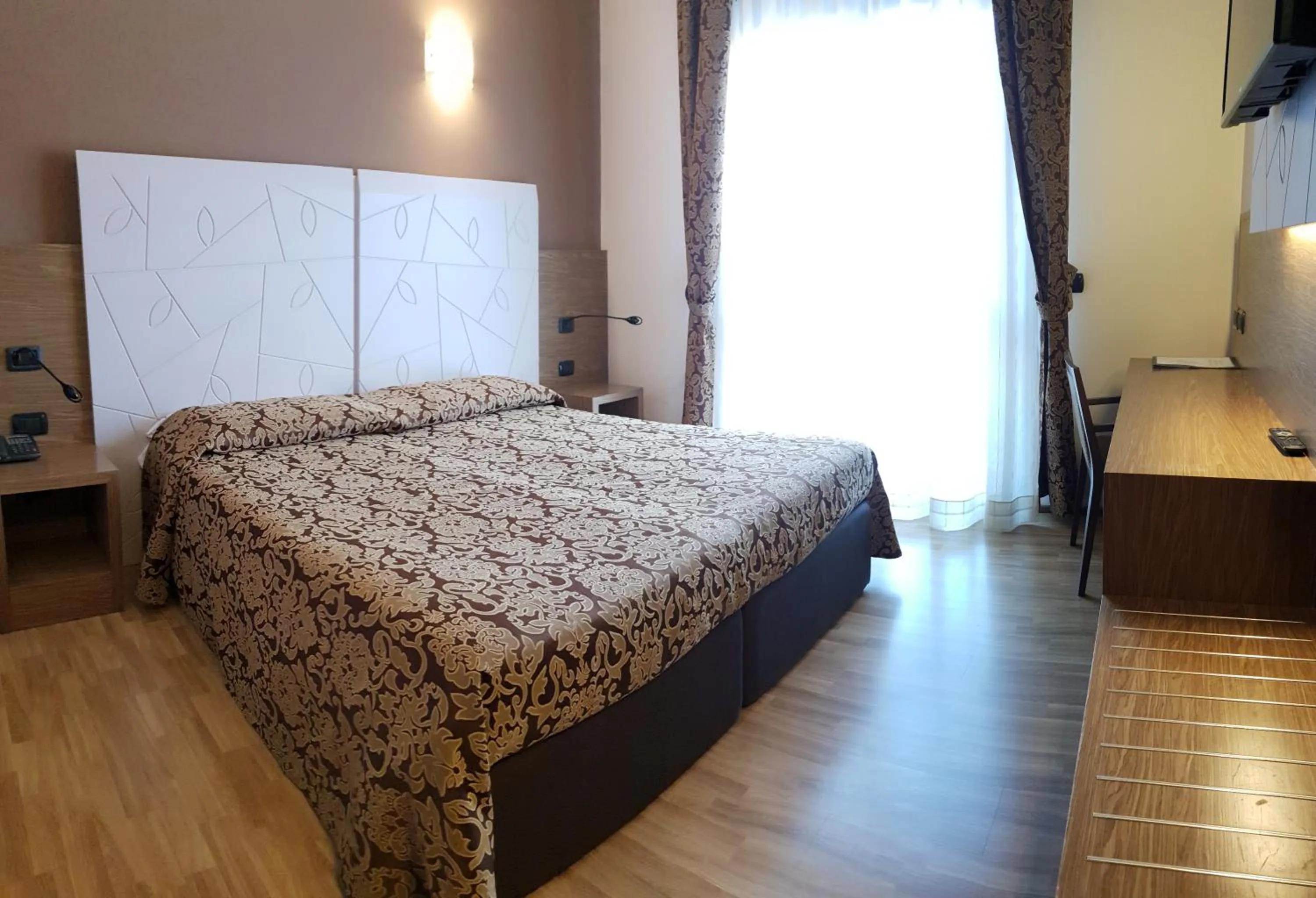 Bedroom in Albergo Ristorante Il Delfino