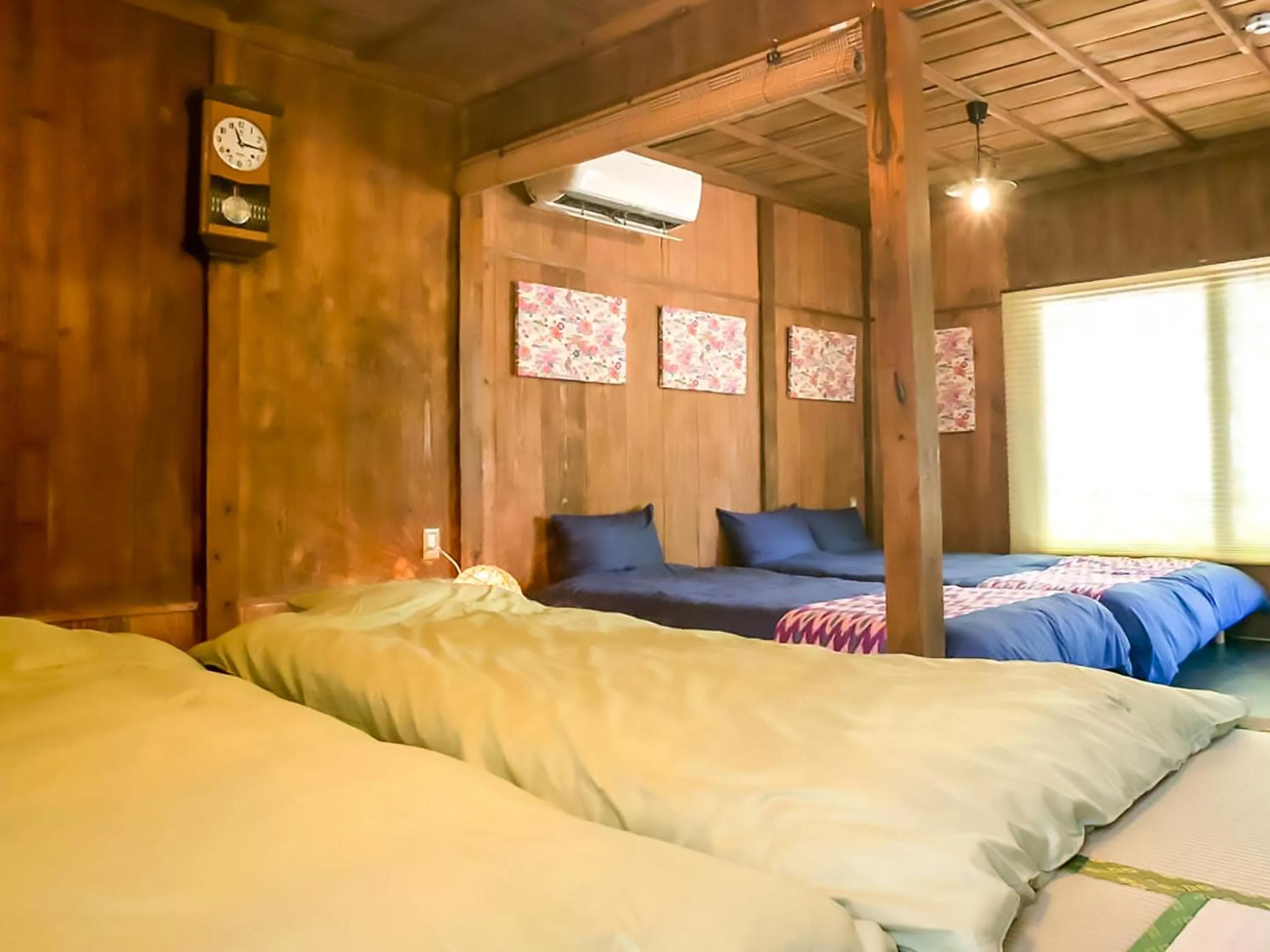 Photo of the whole room, Bed in 国際通りと牧志駅まで徒歩5分 庭付き素敵な古民家 わらゆんSO 松武の古民家Traditional house