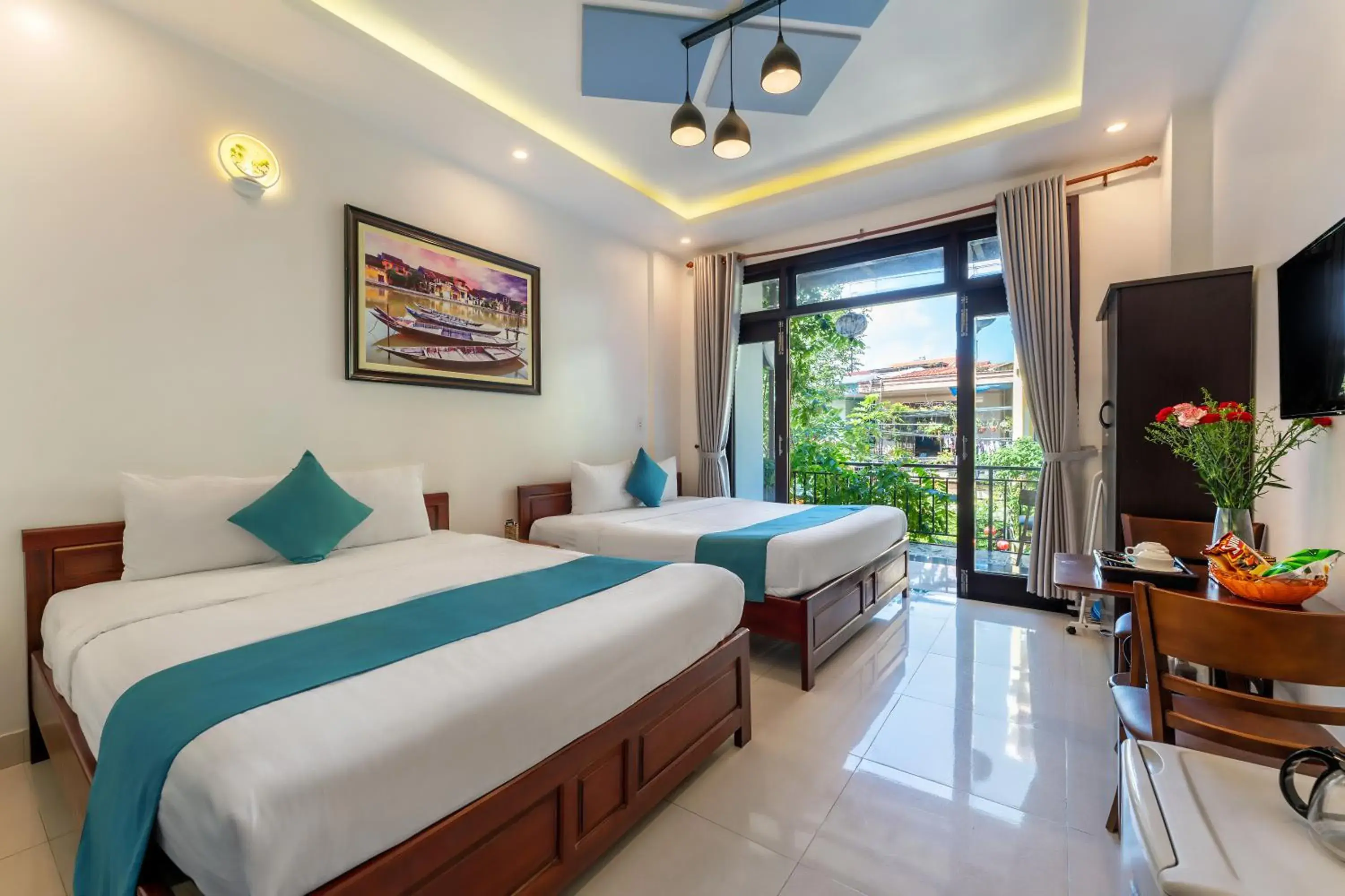 Communal lounge/ TV room, Bed in Rockmouse Centre River Villa Hoi An Communal lounge/ TV room, Bed in Rockmouse Centre River Villa Hoi An