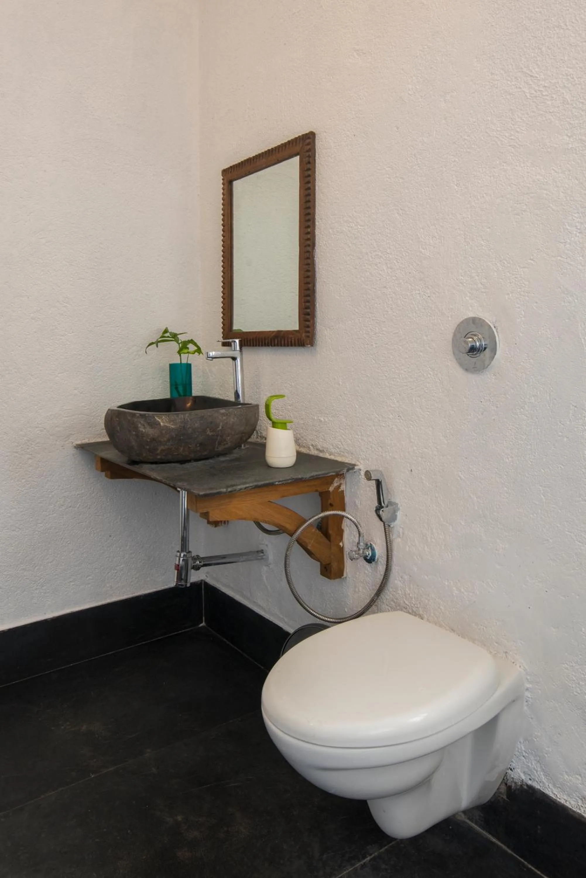 Toilet in Bungalow 89 by StayVista - A hill-view villa adorned with eclectic interiors for a truly unique & captivating stay