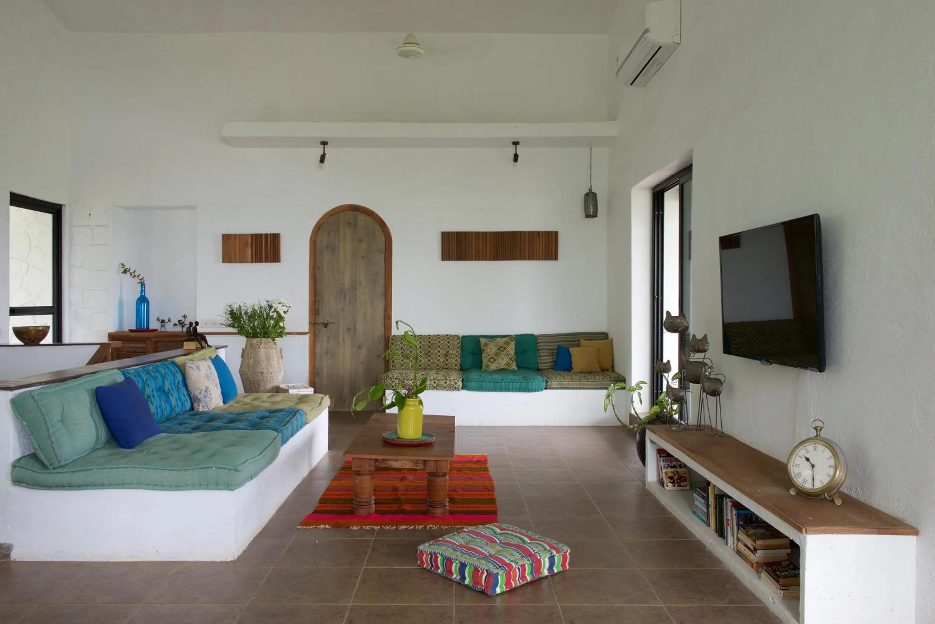 Living room, Bed in Bungalow 89 by StayVista - A hill-view villa adorned with eclectic interiors for a truly unique & captivating stay