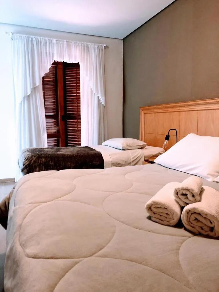 Bed in Pousada Condado Brasileiro