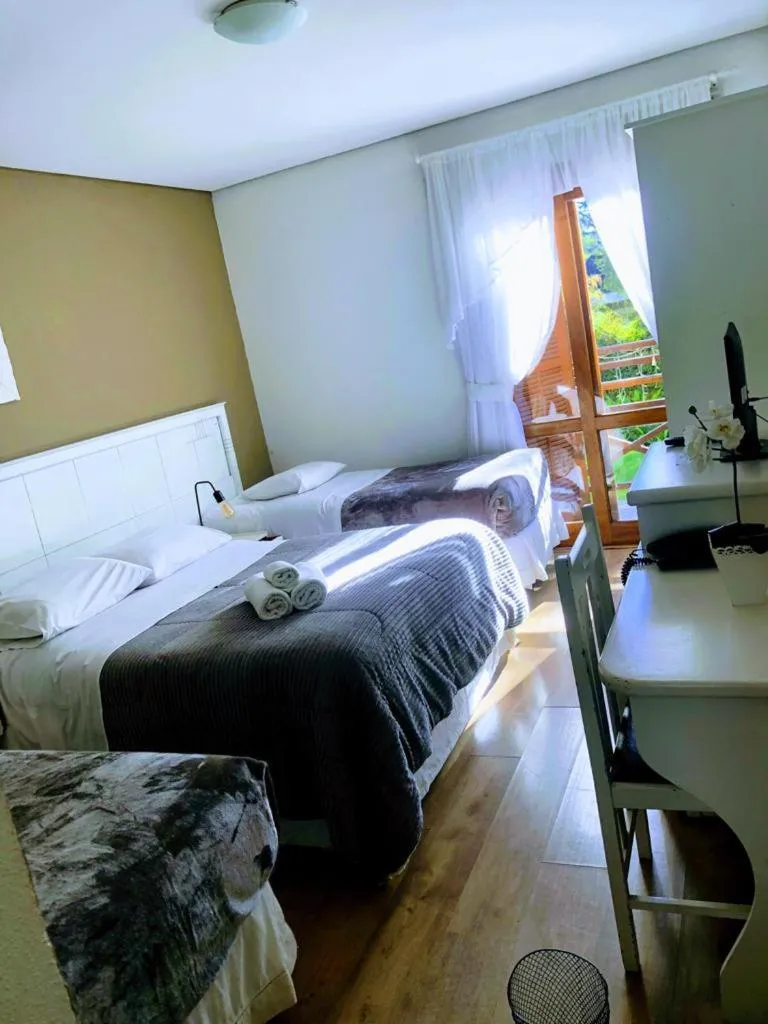 Bed in Pousada Condado Brasileiro