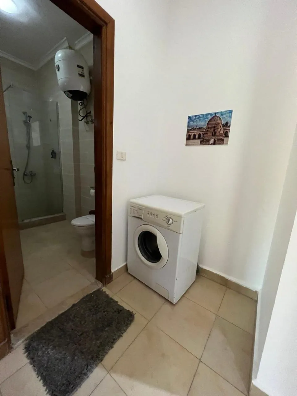 washing machine in Lilly Apartments